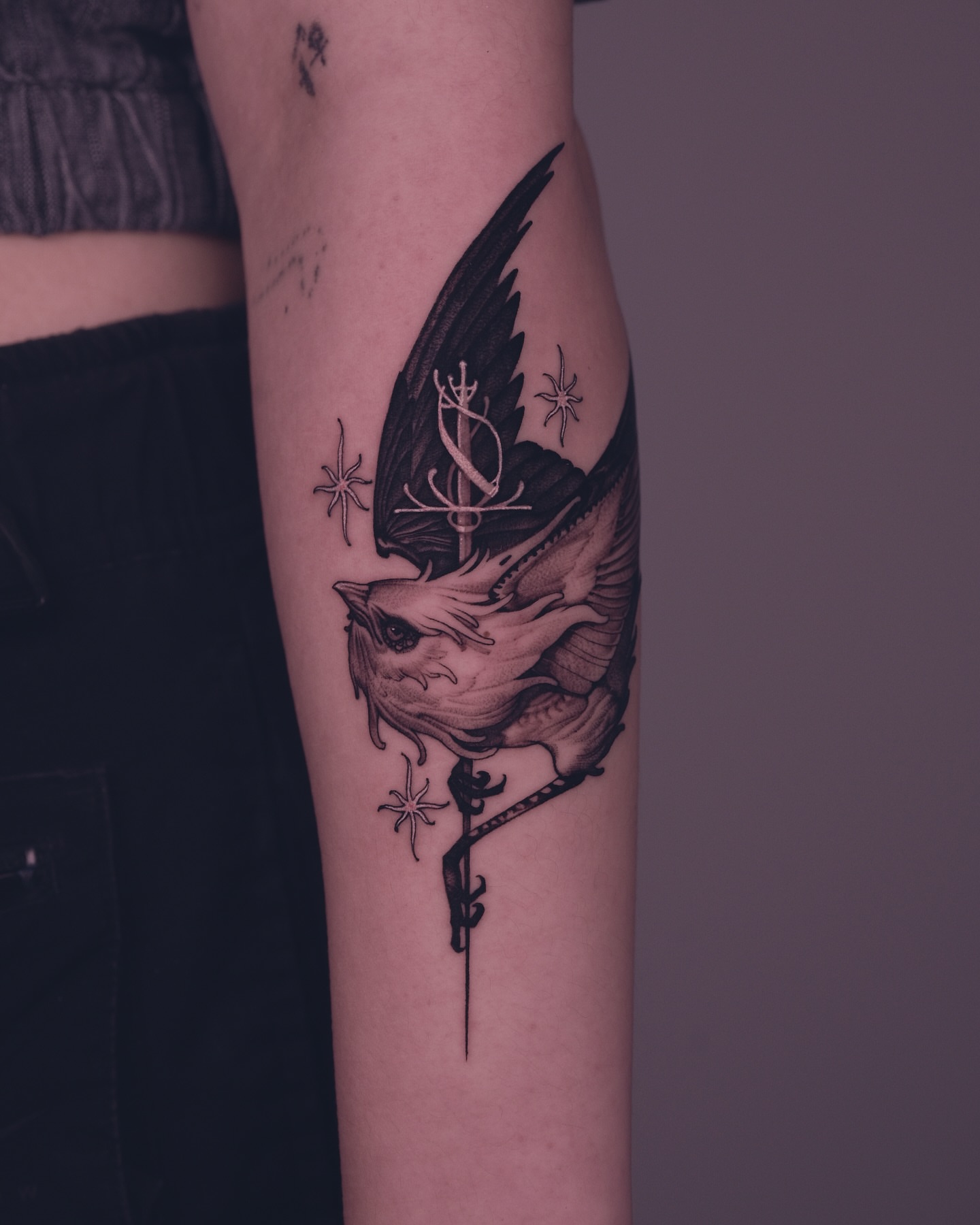 Bird and key realism tattoo on the forearm by 9rukim