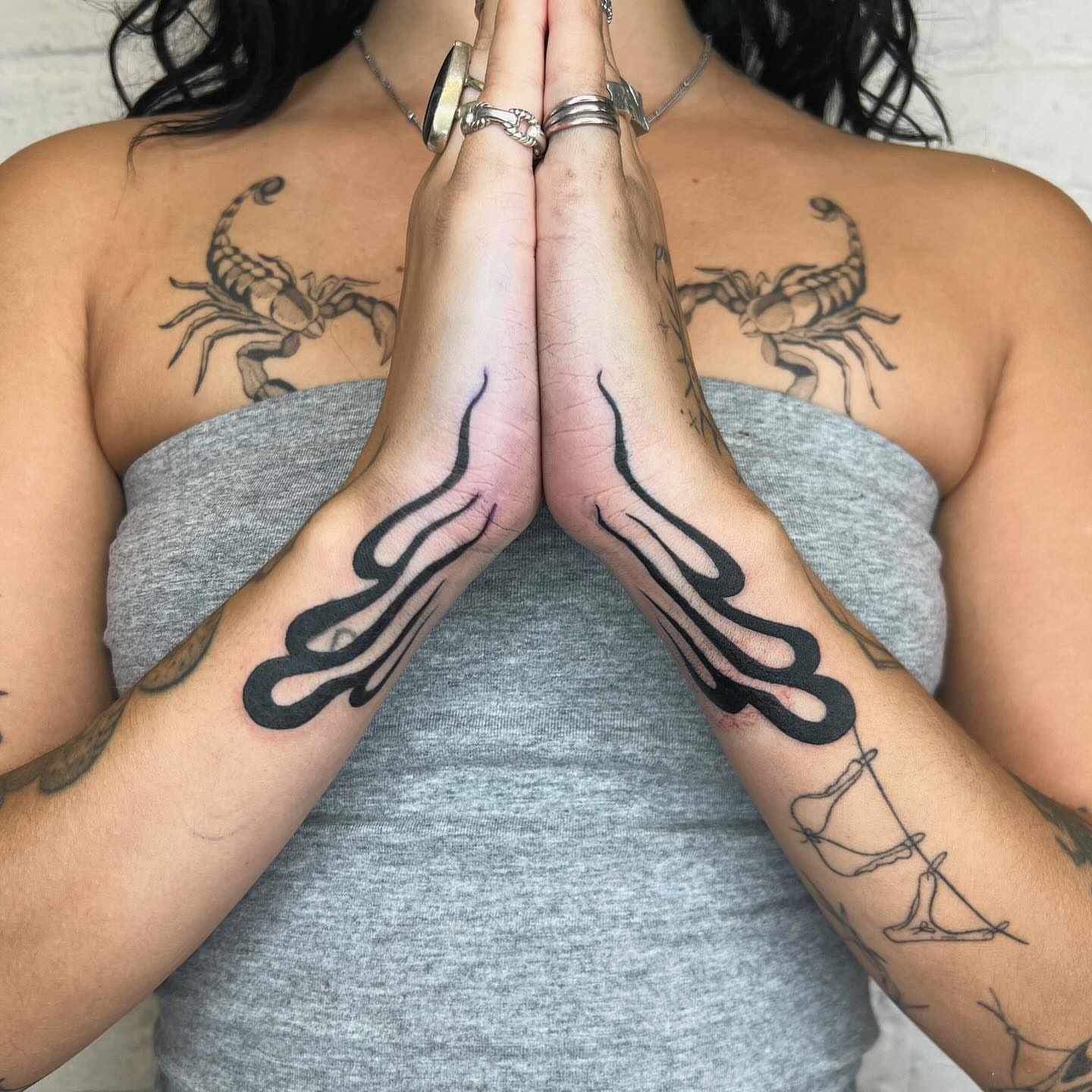 Flame tribal tattoo on the upper arm by Robb Wilson
