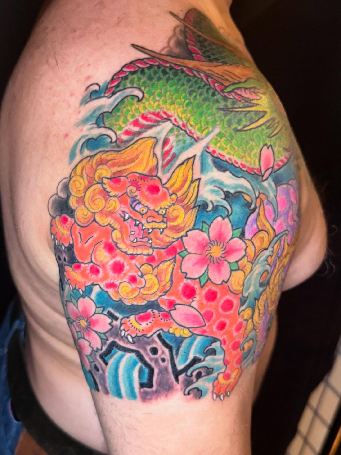 Koi fish and cherry blossoms japanese irezumi tattoo on the shoulder by Patrick Cornolo