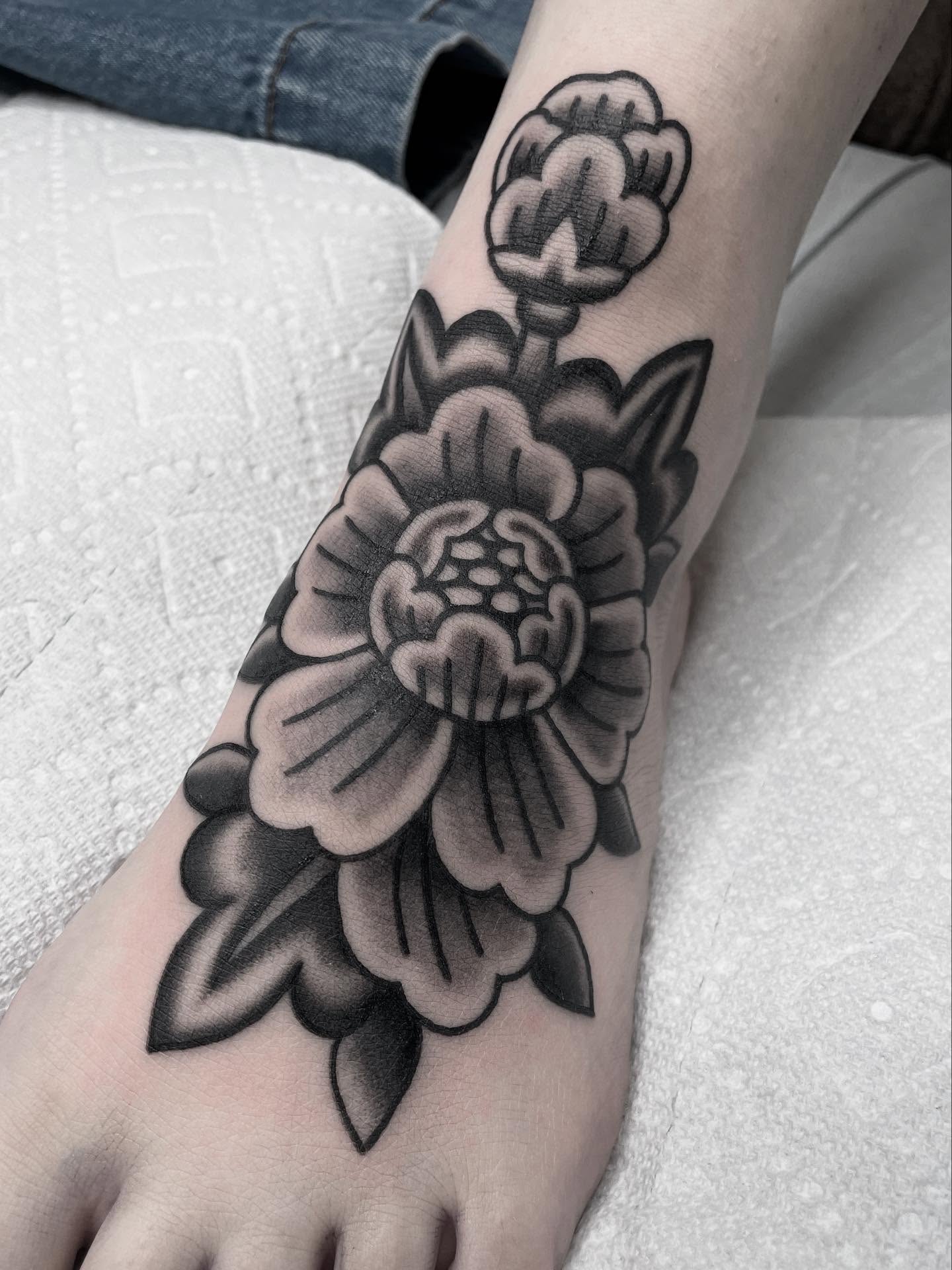 Flower black and grey tattoo on the foot by Kat, Sacramento, California