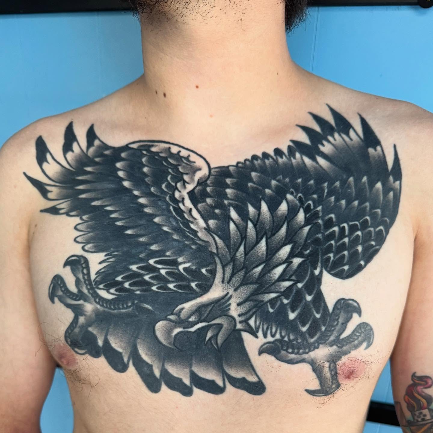Eagle black and grey tattoo on the chest by Brian Herrera