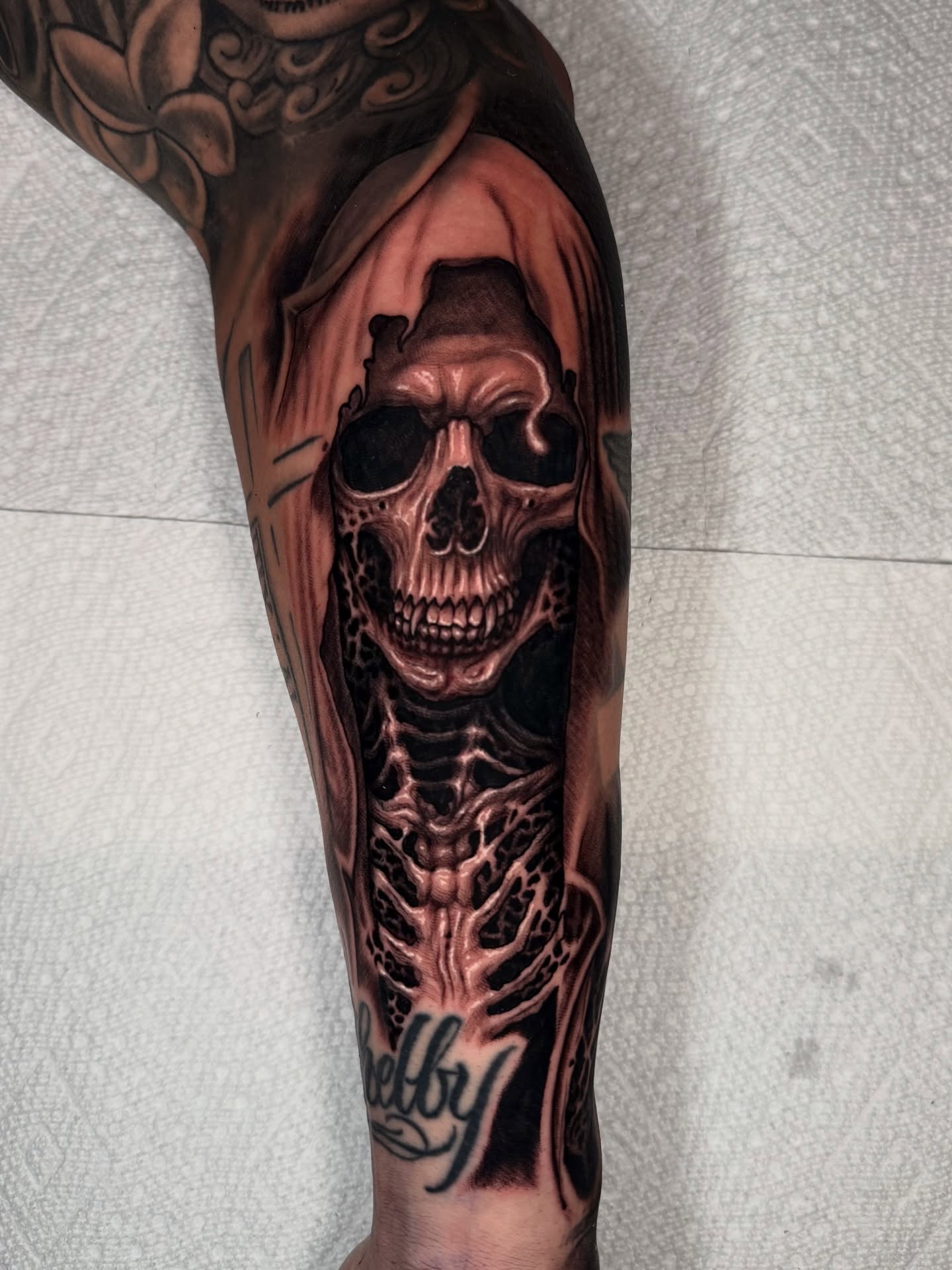 Skull realism tattoo on the forearm by Isaac