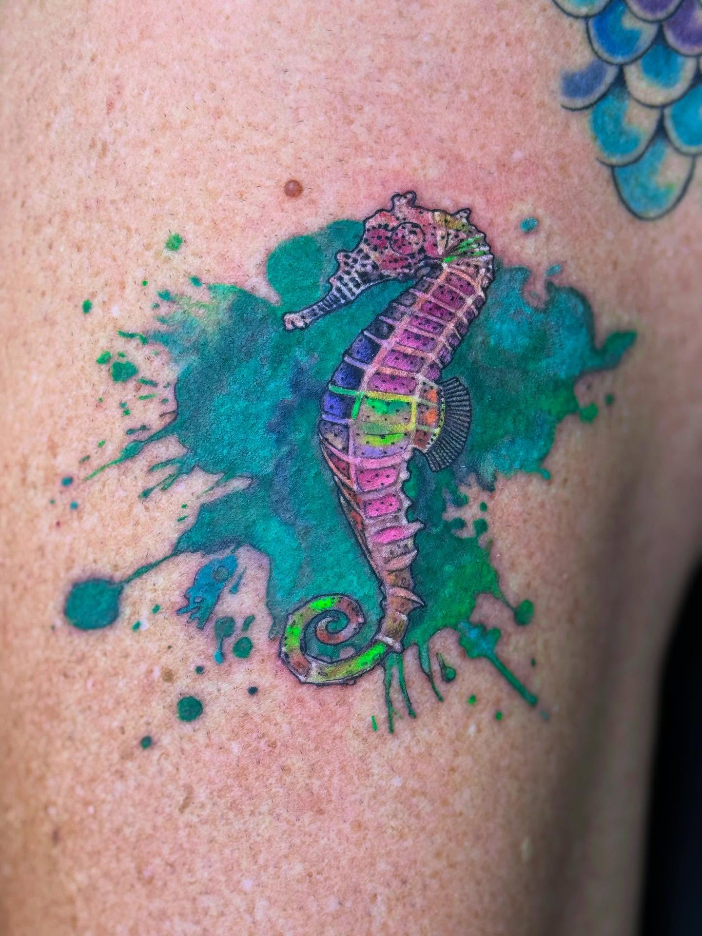 Seahorse watercolor tattoo on the shoulder by Aaron Hassler, Nashville, Tennessee