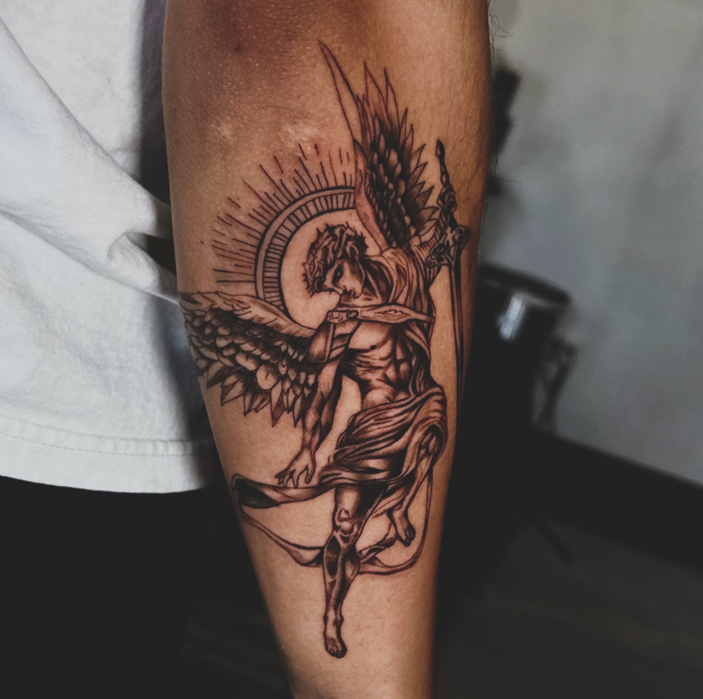 Angelic figure realism tattoo on the forearm by V