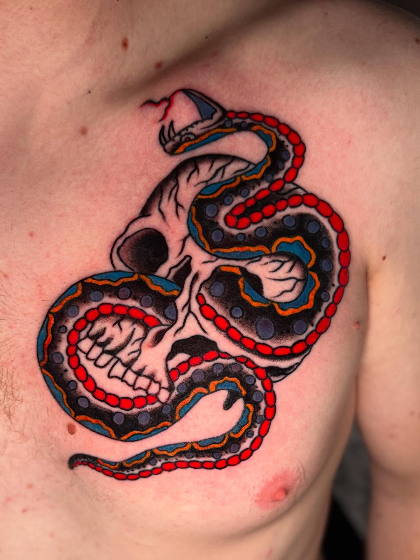 Snake and skull dotwork tattoo on the chest by Seth Walker