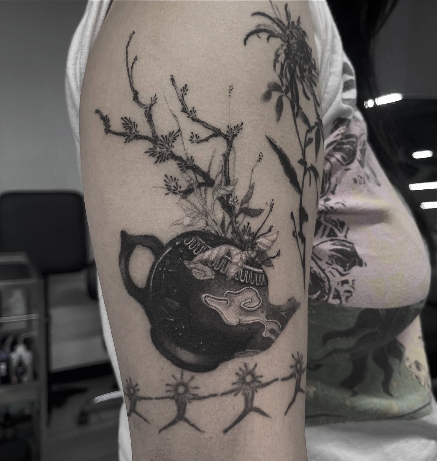 Teapot with flowers dotwork tattoo on the forearm by Joshua Hung, Alhambra, California