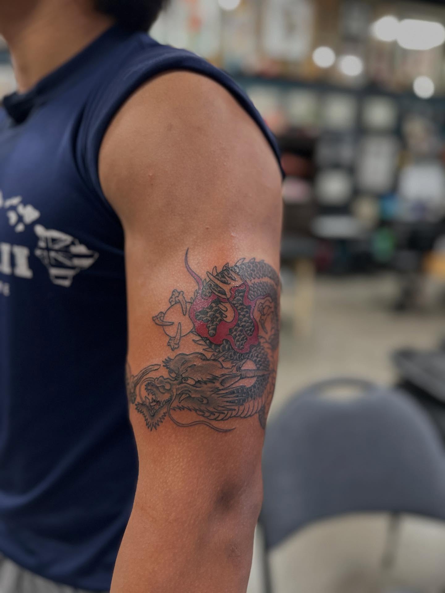 Dragon American traditional tattoo on the forearm by Shawn Feng
