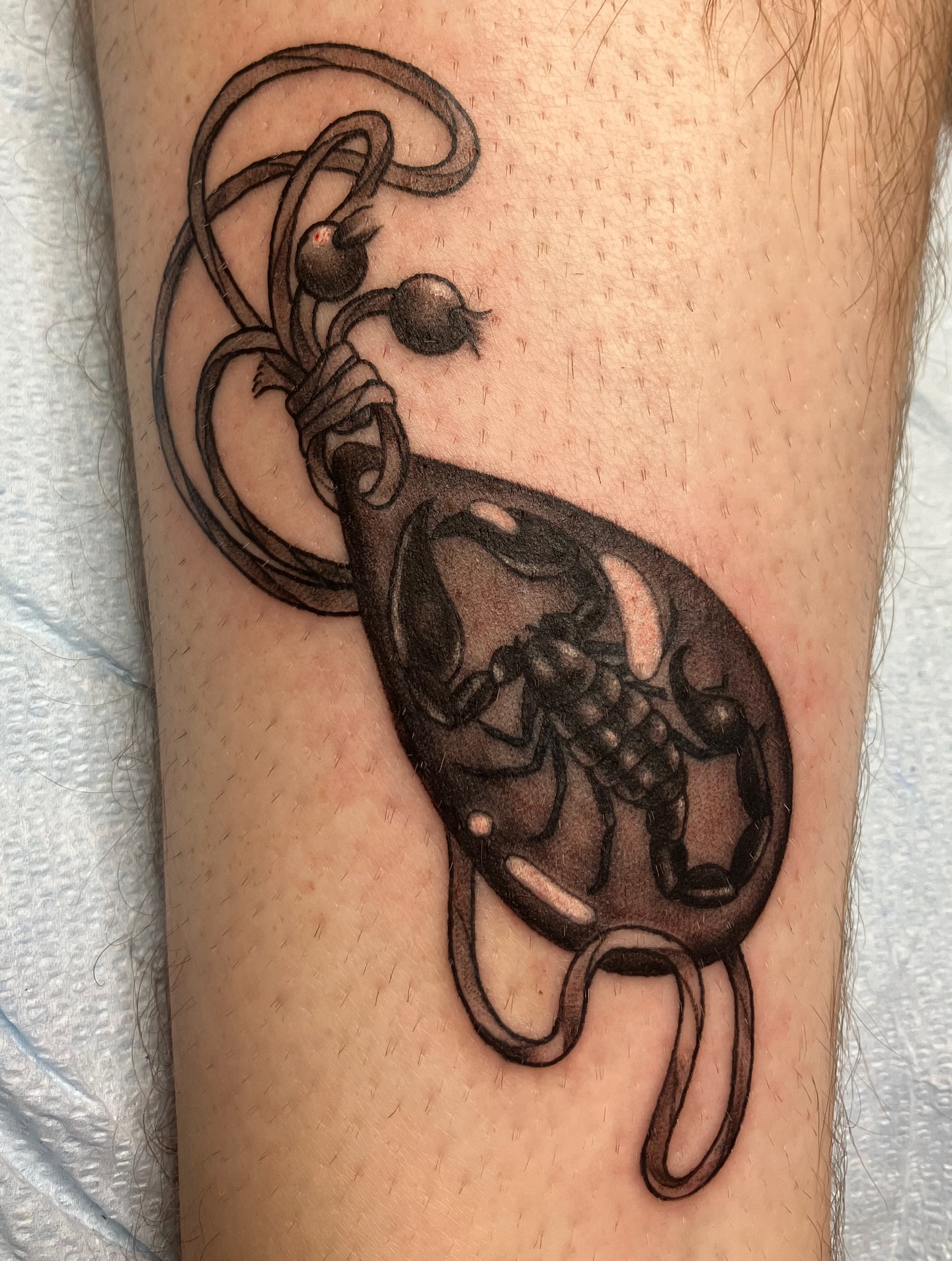 Scorpion black and grey tattoo on the forearm by Hunter McGinnis