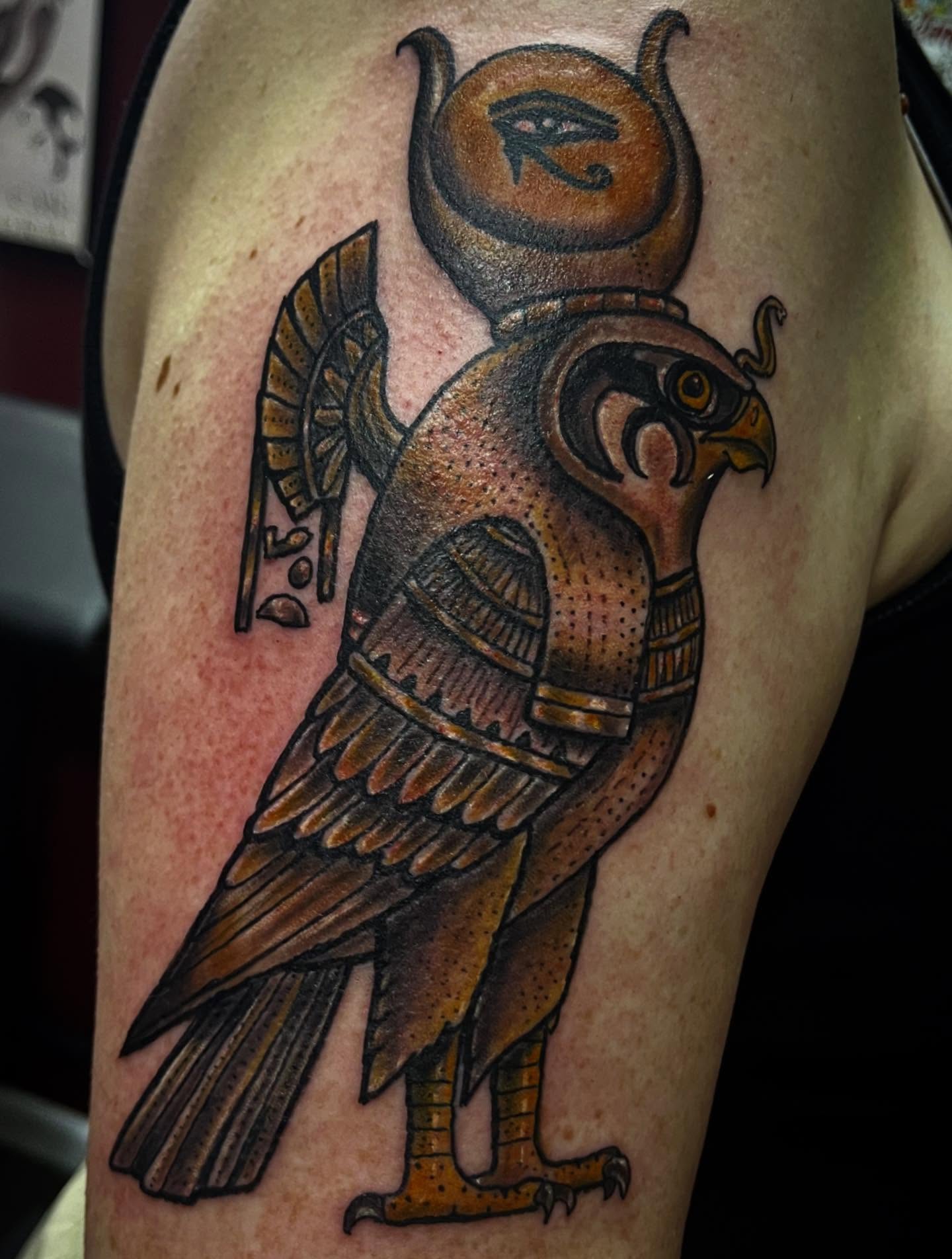 Hawk with eye symbol American traditional tattoo on the forearm by Bobby Glennon