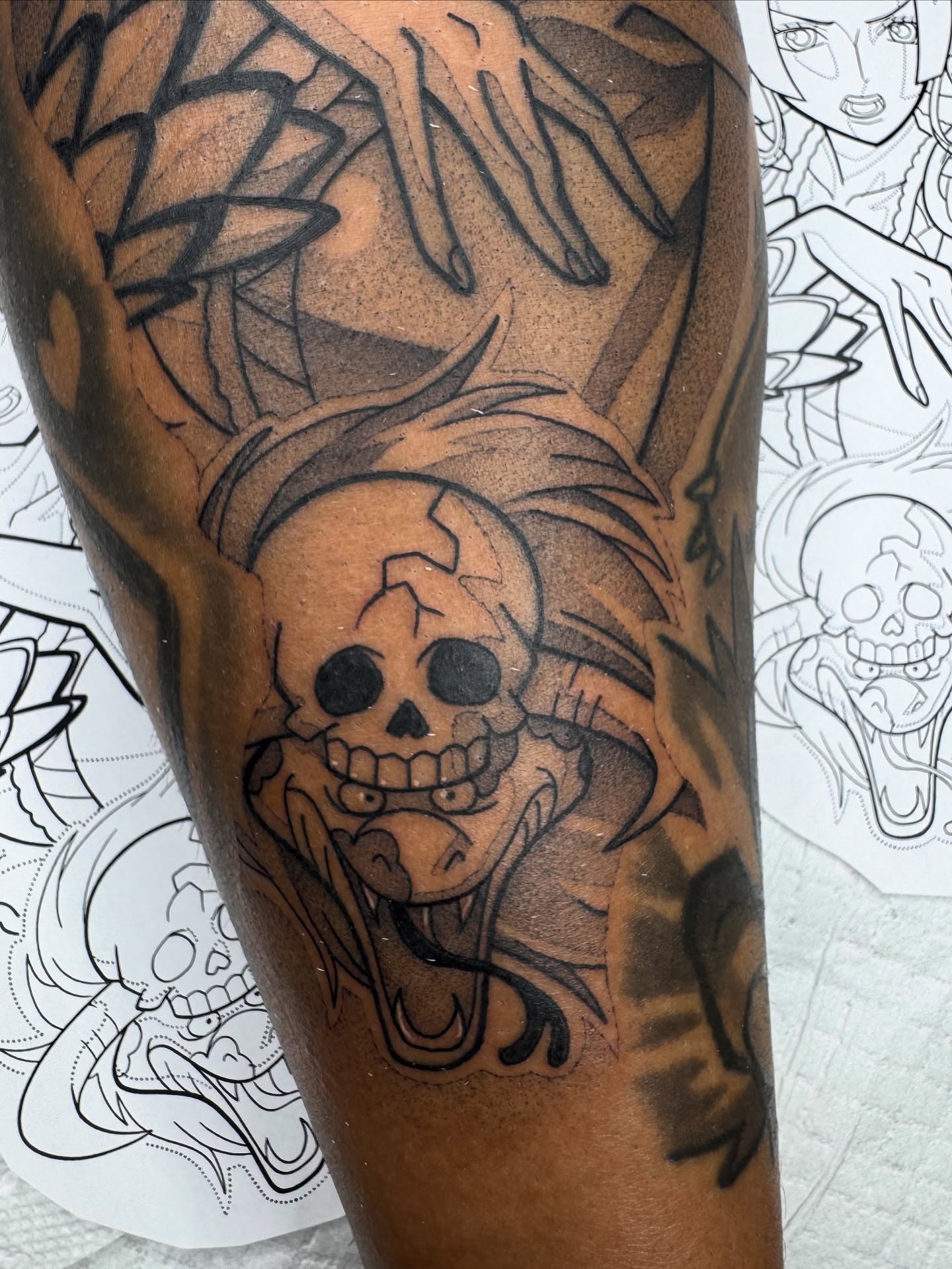 Skull with wings black and grey tattoo on the forearm by Donnie Moore