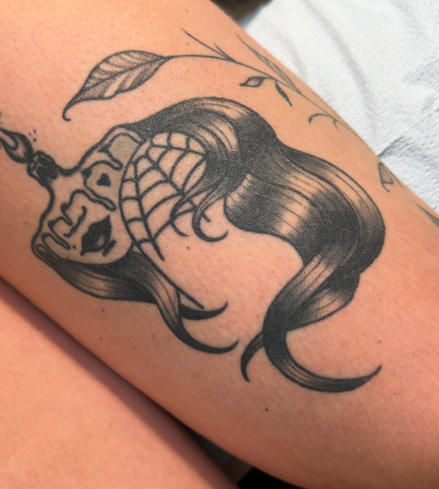 Woman with skull American traditional tattoo on the forearm by Mazie