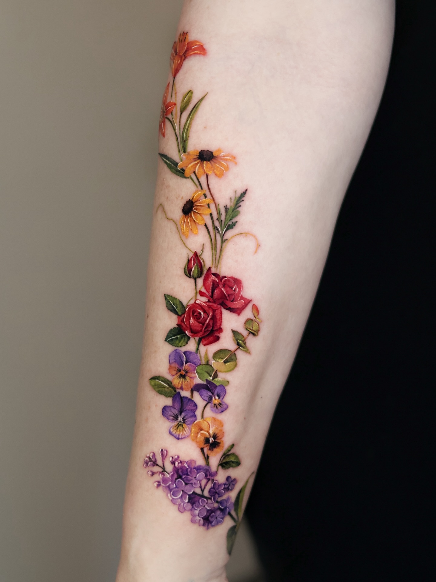 Floral arrangement realism tattoo on the forearm by 𝒀𝒖𝒏𝒎𝒊 𝑷𝒂𝒓𝒌