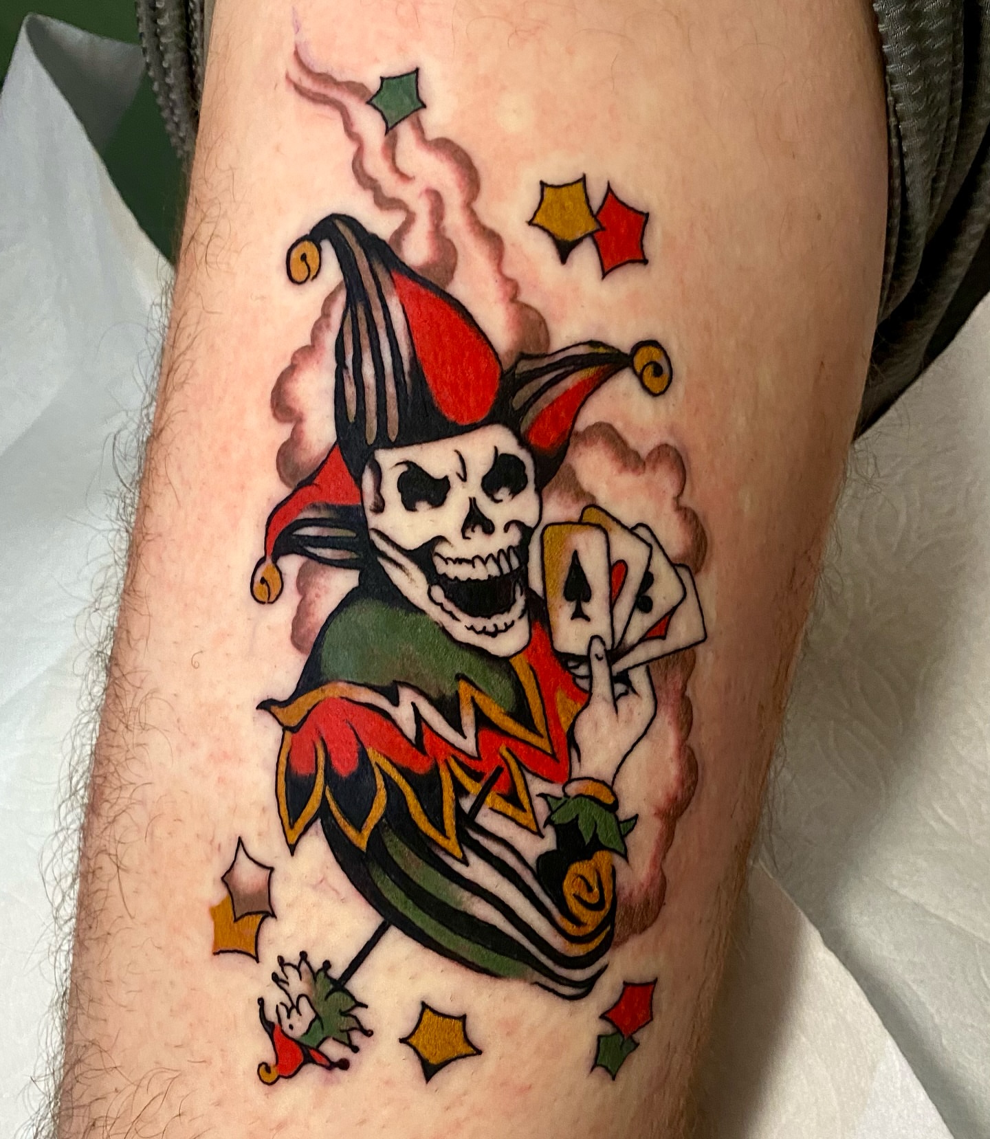 Joker with cards American traditional tattoo on the forearm by Haley Tucker, Sebastopol, California