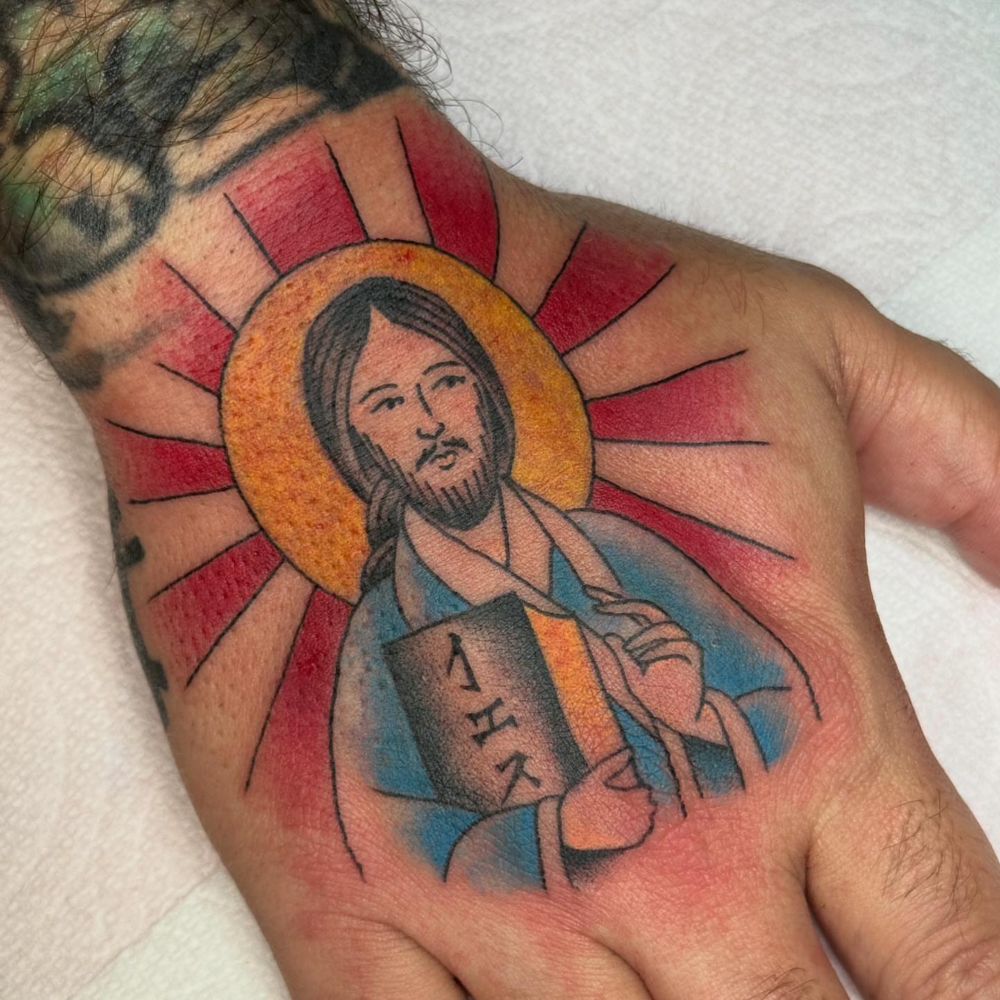 Religious figure American traditional tattoo on the hand by chloe jeanel estrada