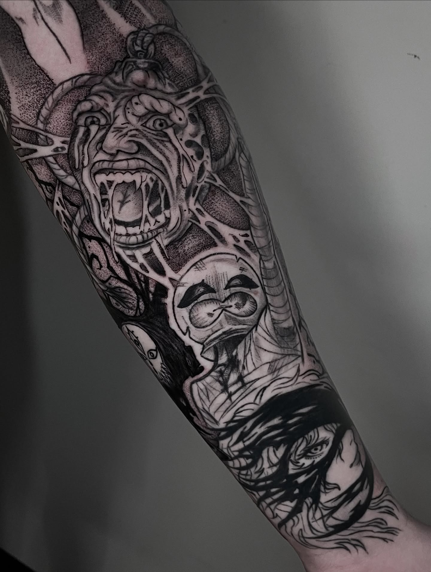 Angry face dotwork tattoo on the forearm by Kathryn the Tooth Collector