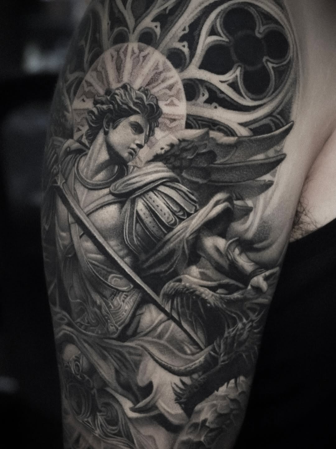 Archangel Michael fighting a dragon realism tattoo on the forearm by D A N N y L I N