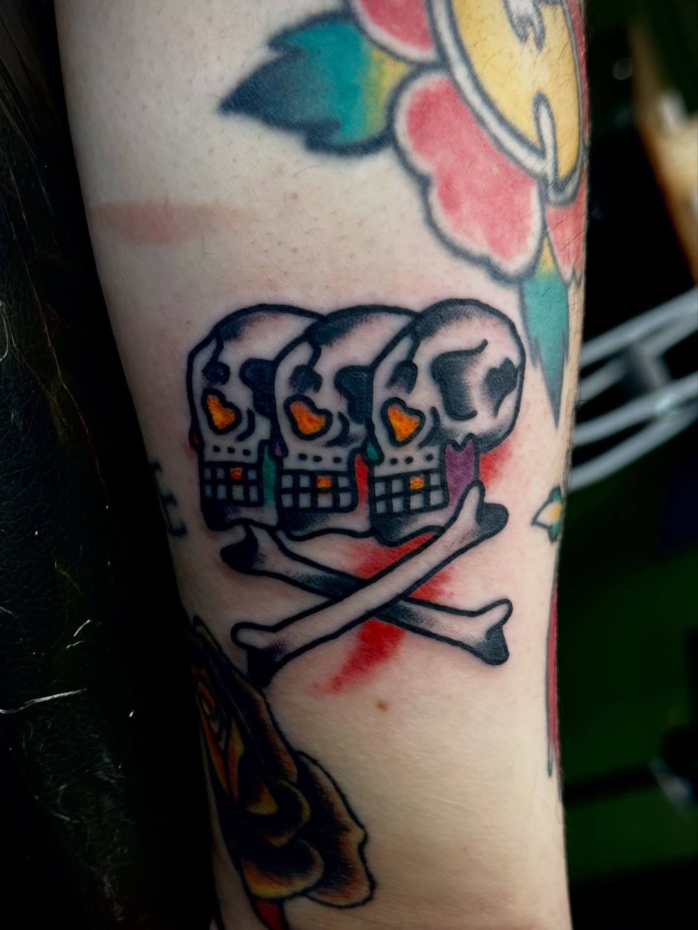Skulls and crossbones American traditional tattoo on the forearm by Kyle O’Hara ॐ, Nashville, Tennessee