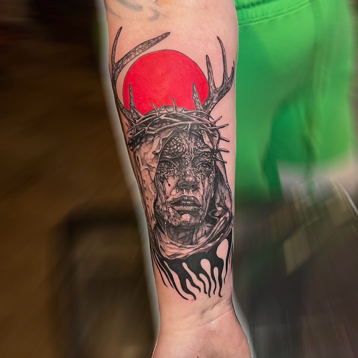 Deity with antlers dark realism tattoo on the forearm by Danielle