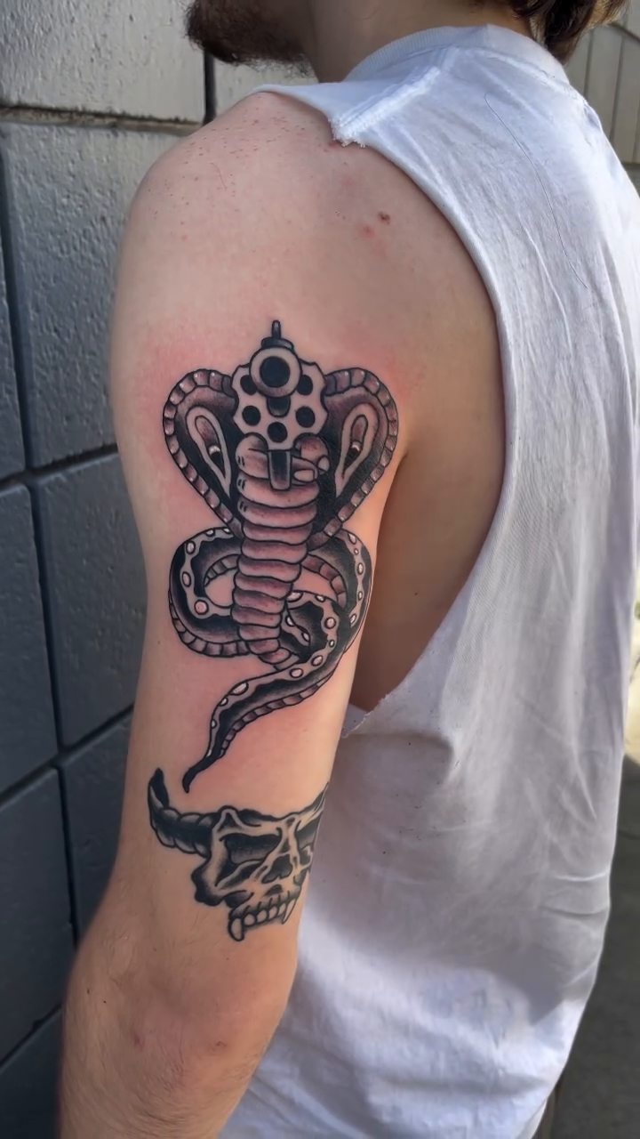 Cobra and skull American traditional tattoo by Dave Kruseman