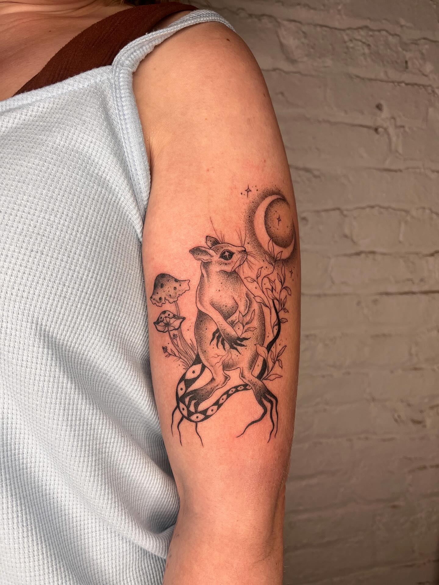 Deer and crescent moon dotwork tattoo on the forearm by 𝔇𝔢𝔰𝔦