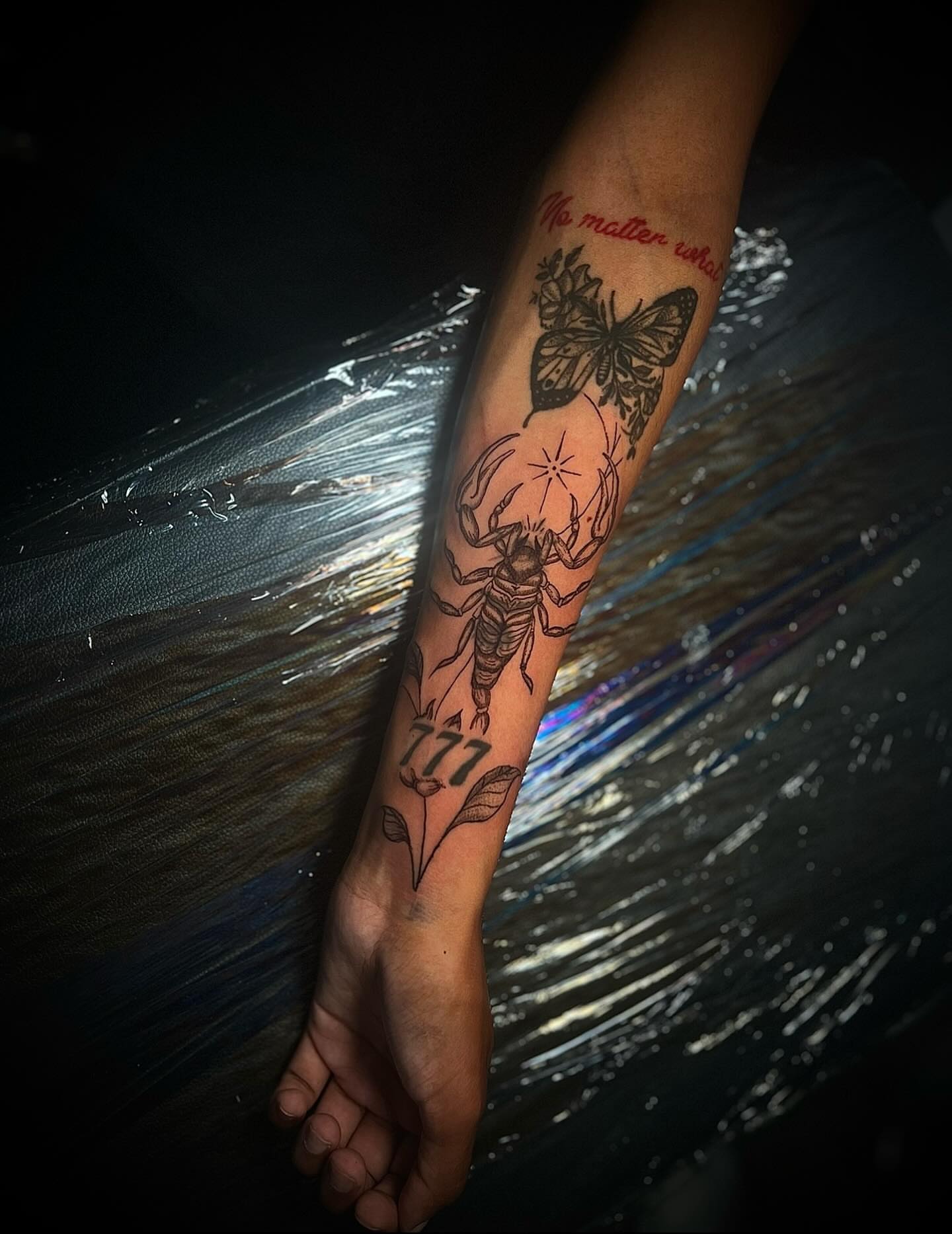 Scorpion and butterfly black and grey tattoo on the forearm by @tattsbyleek
