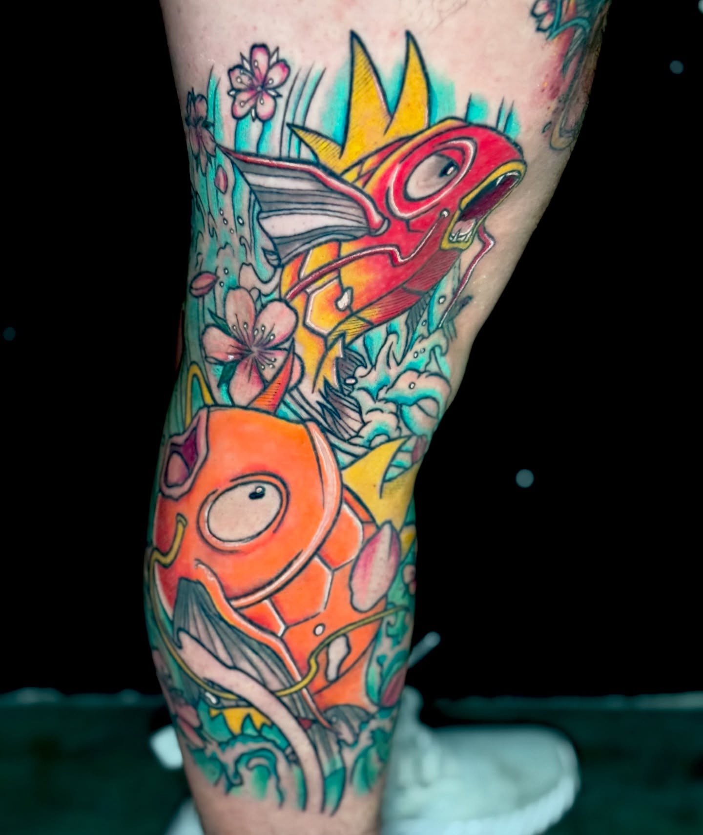 Fish and flowers American traditional tattoo on the forearm by Kevin A. Salinas ๐จ๐ด, Houston, Texas