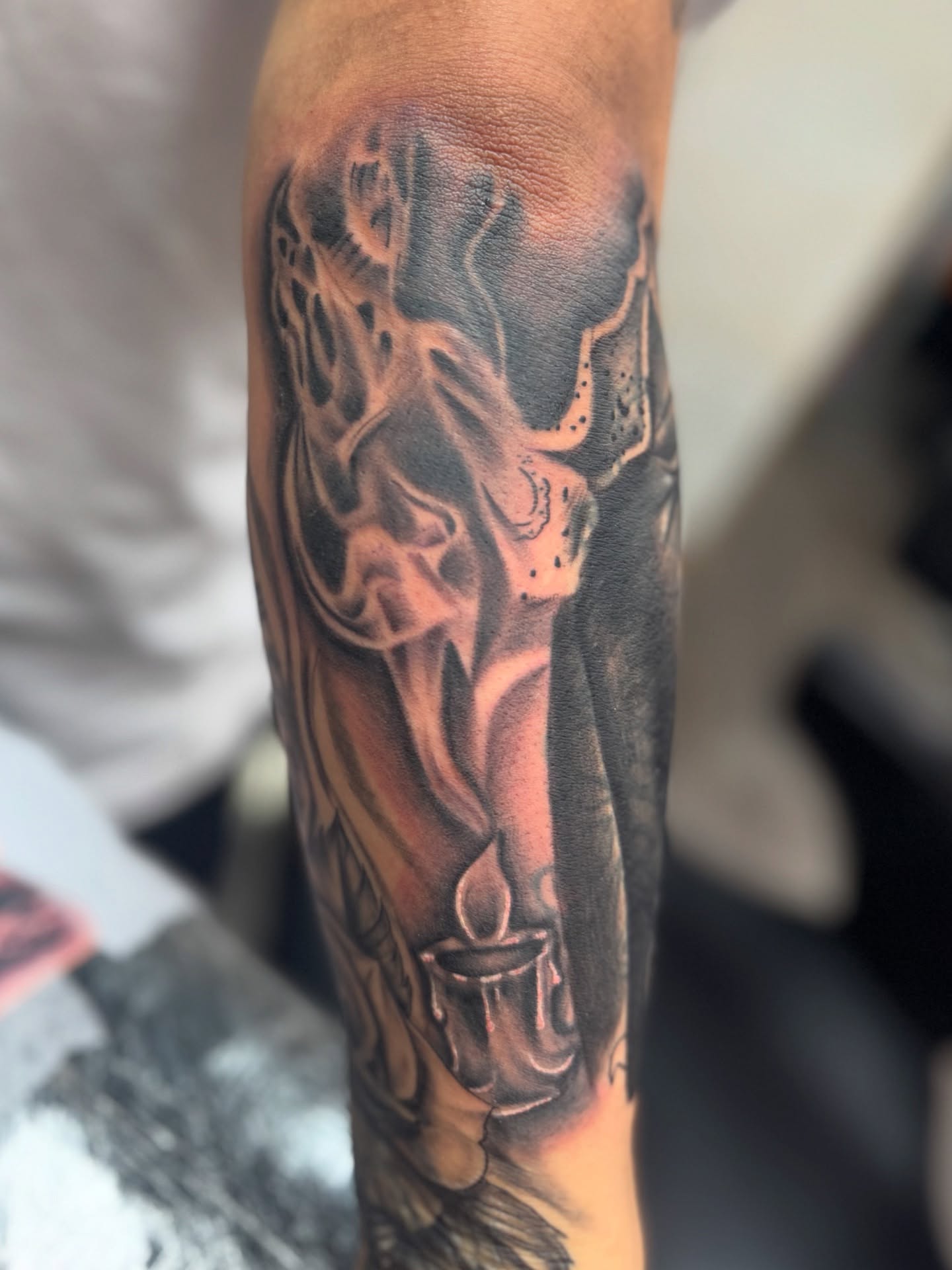 Smoke and candle realism tattoo on the forearm by Rich Kid, New York, New York