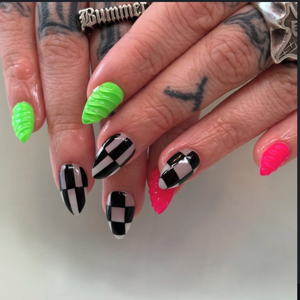 Checkerboard pattern geometric tattoo on the hand by Hannah Edwards, Austin, Texas