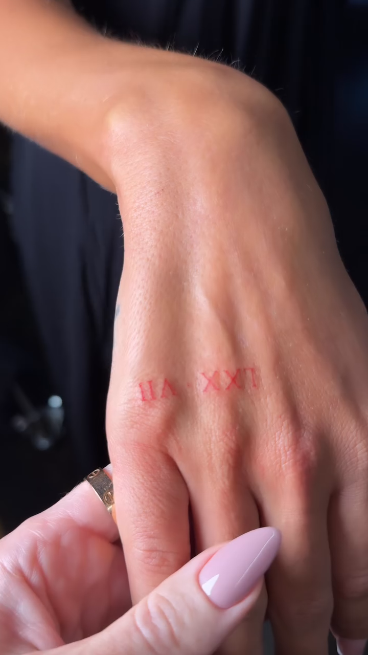 Roman numerals on hand minimalist tattoo on the hand by @blackastaratattoo