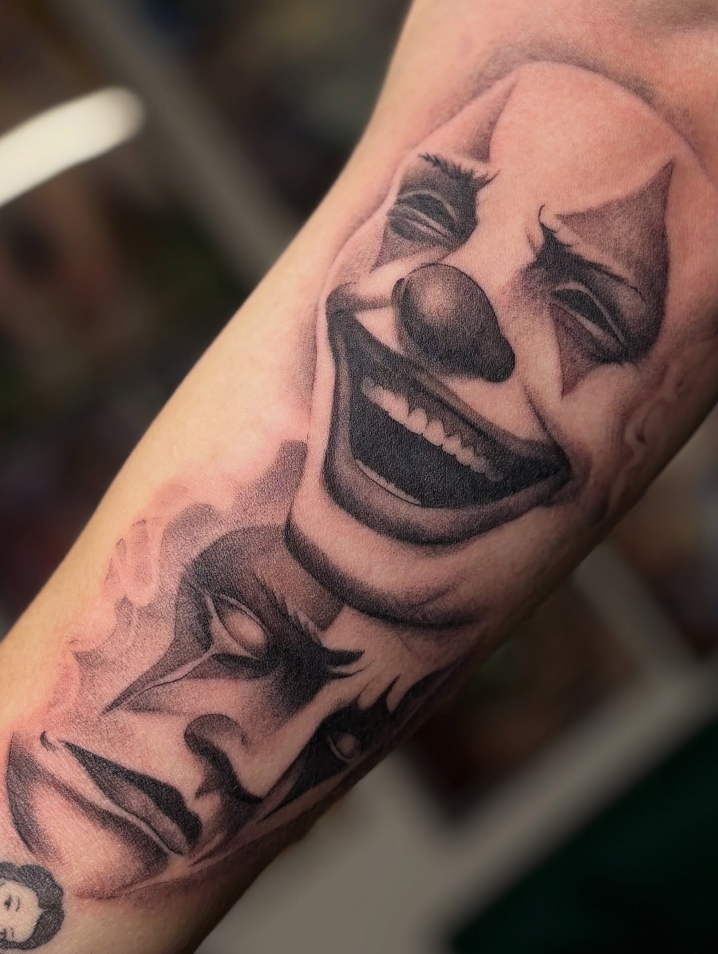 Clown realism tattoo on the forearm by @divineink_nyc
