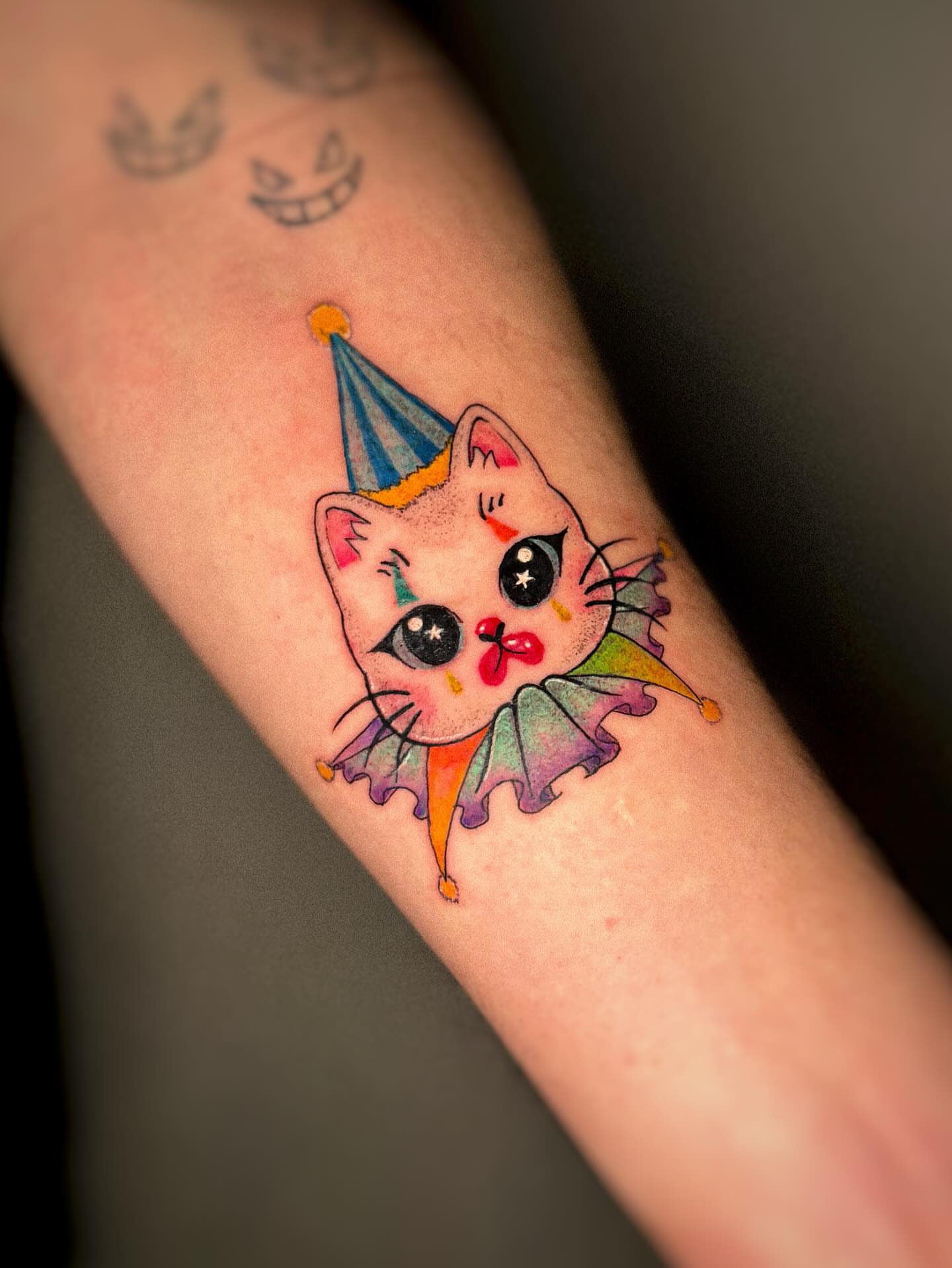 Clown cat new school tattoo on the forearm by 조조