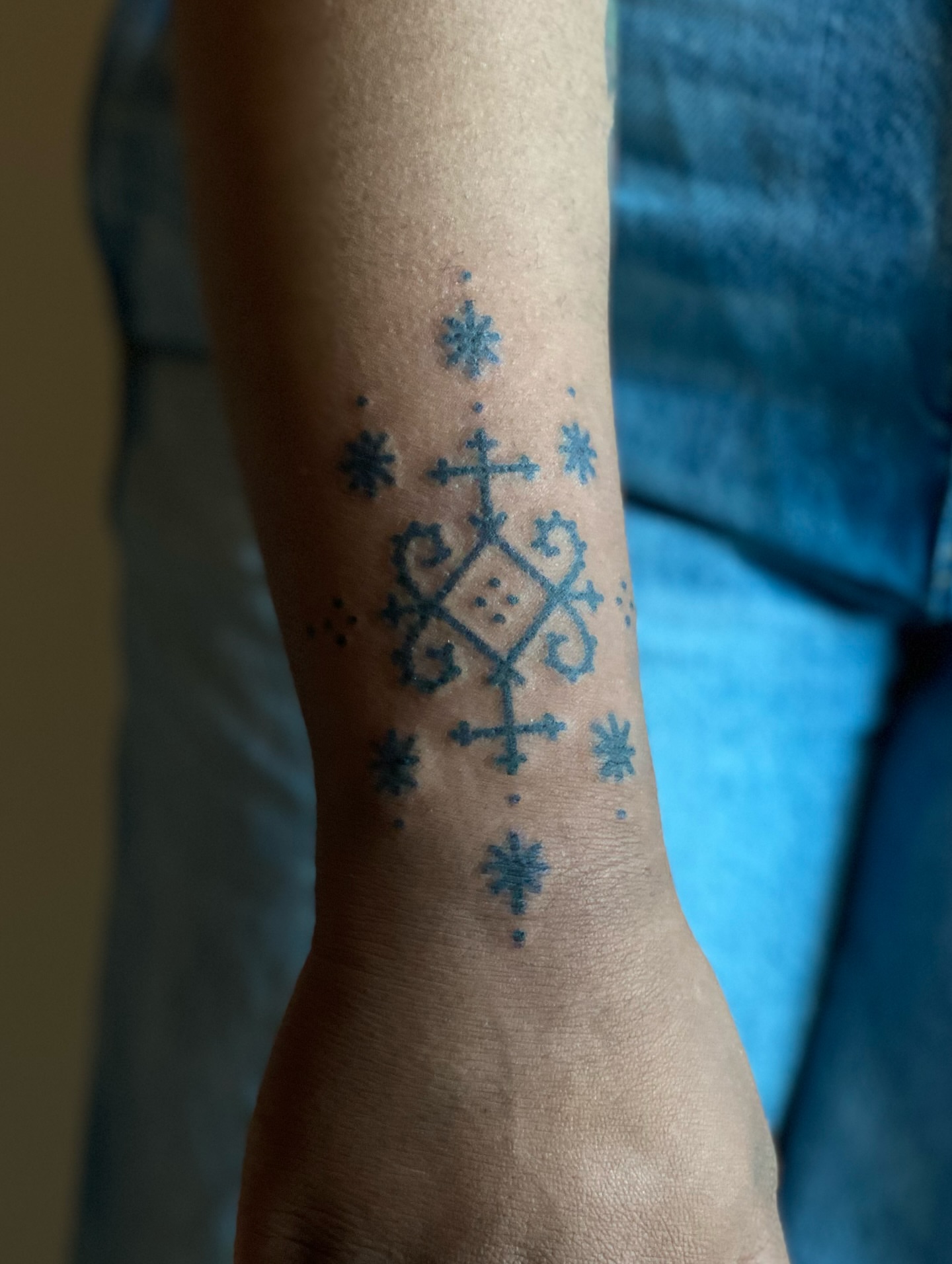 Geometric pattern dotwork tattoo on the forearm by Handpoked Tattoos