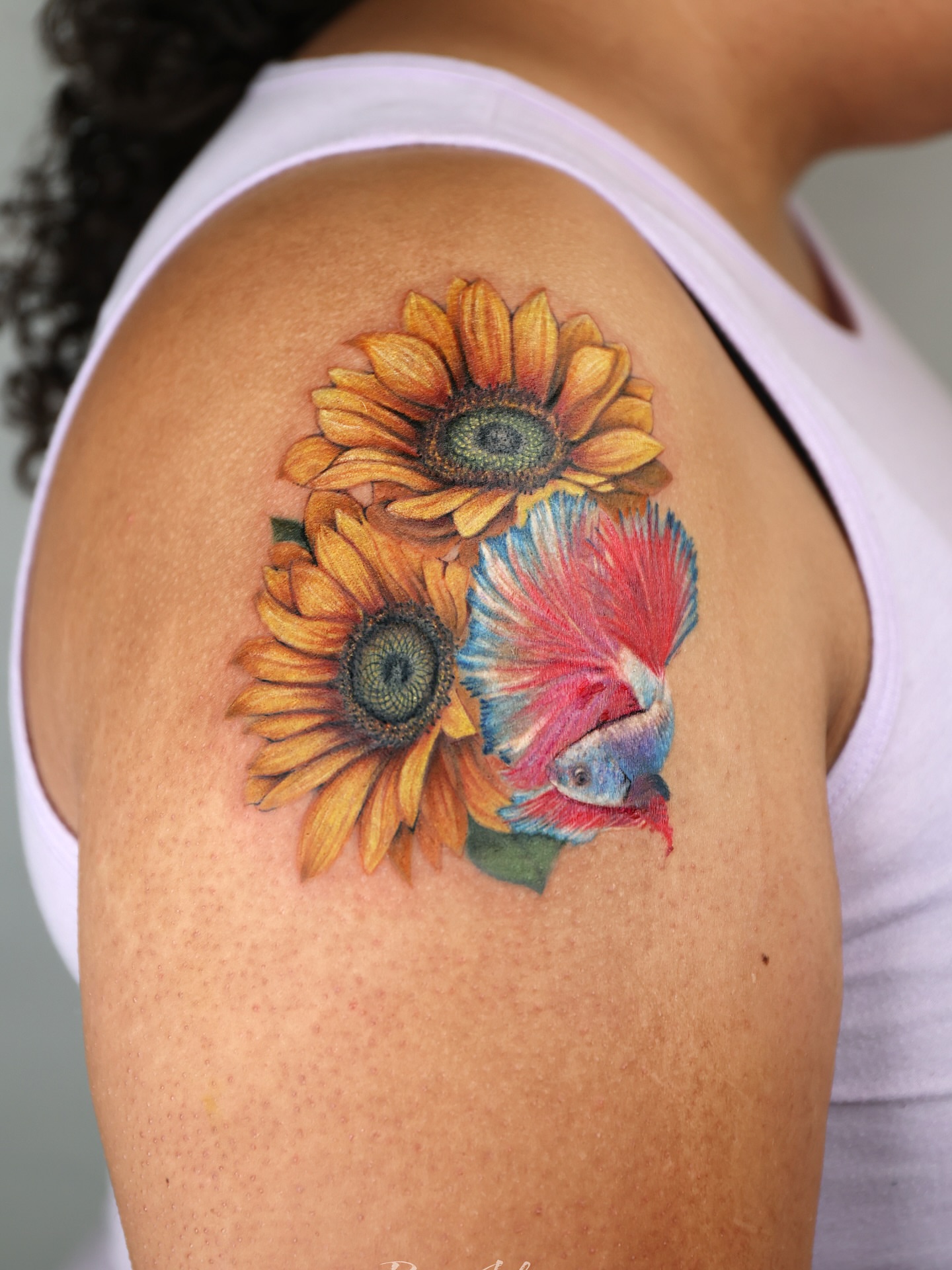 Sunflowers and fish realism tattoo on the shoulder by Adam_Zhiwei Xu(Tattooist)
