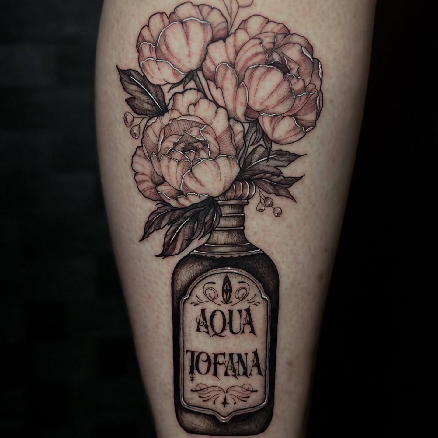 Peony bouquet black and grey tattoo on the forearm by Sabrina, Harrison, New Jersey