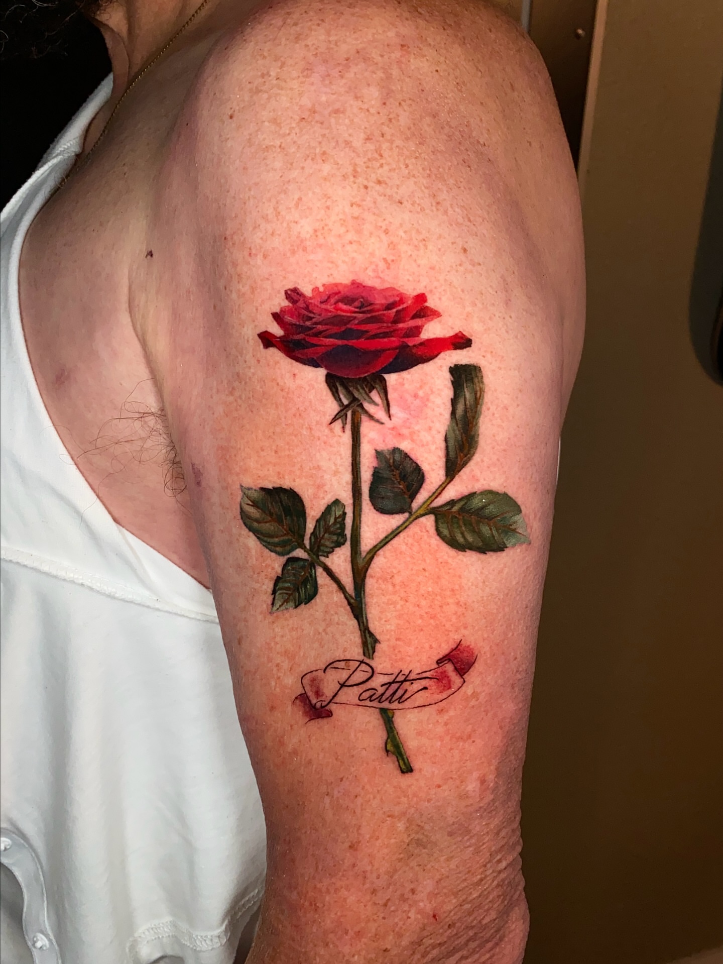 Red rose realism tattoo by Gerardo Brawder