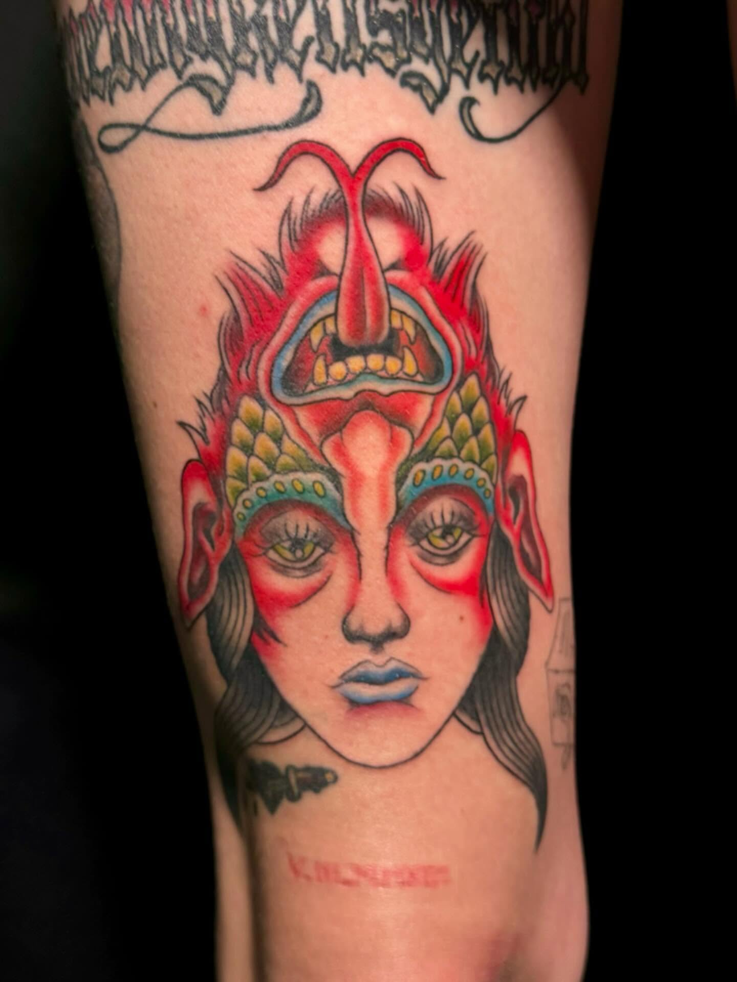 Demon face American traditional tattoo on the forearm by Paris Romano