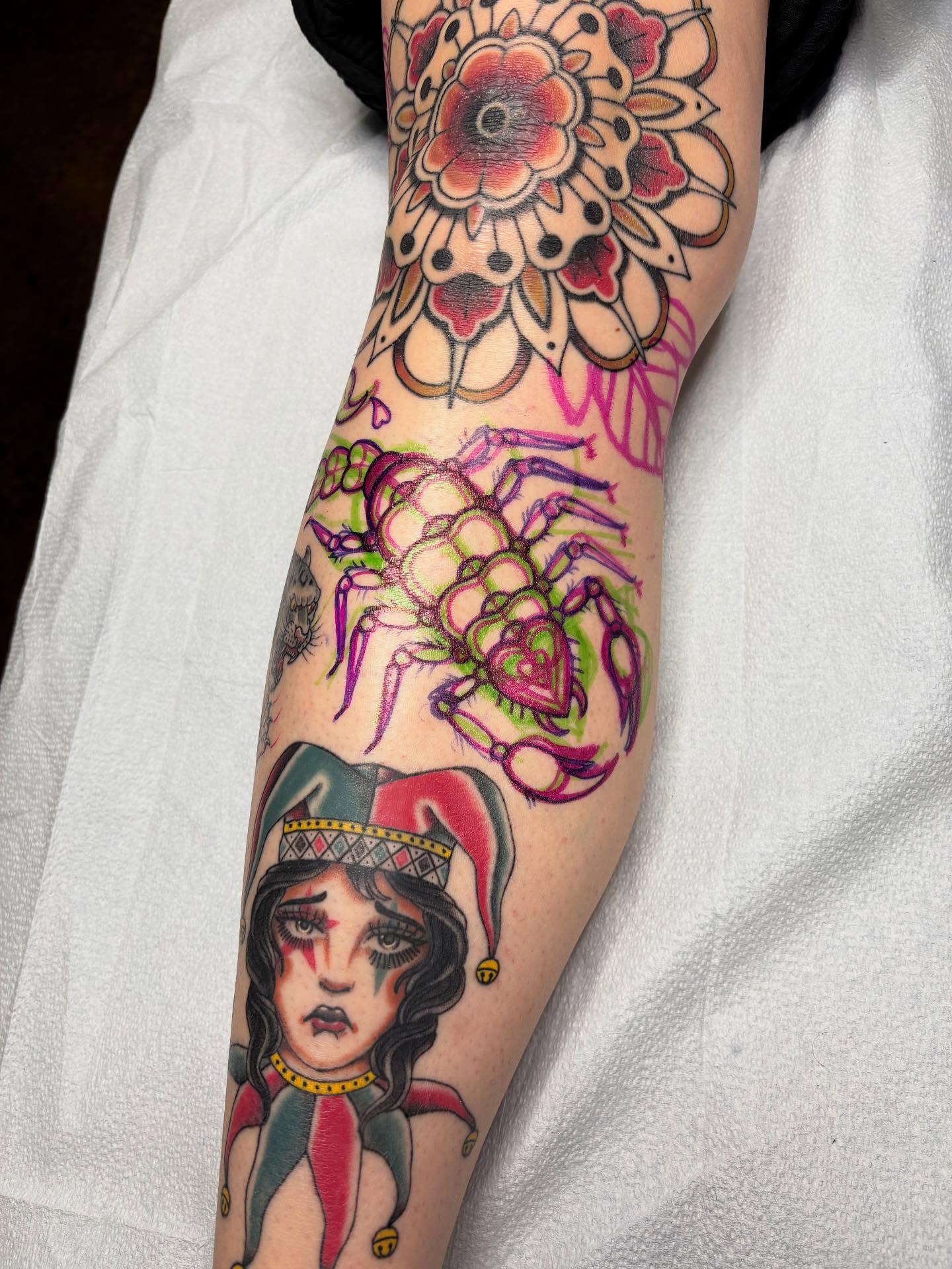 Jester and crab American traditional tattoo on the forearm by Jakob Ristau, Kansas City, Missouri
