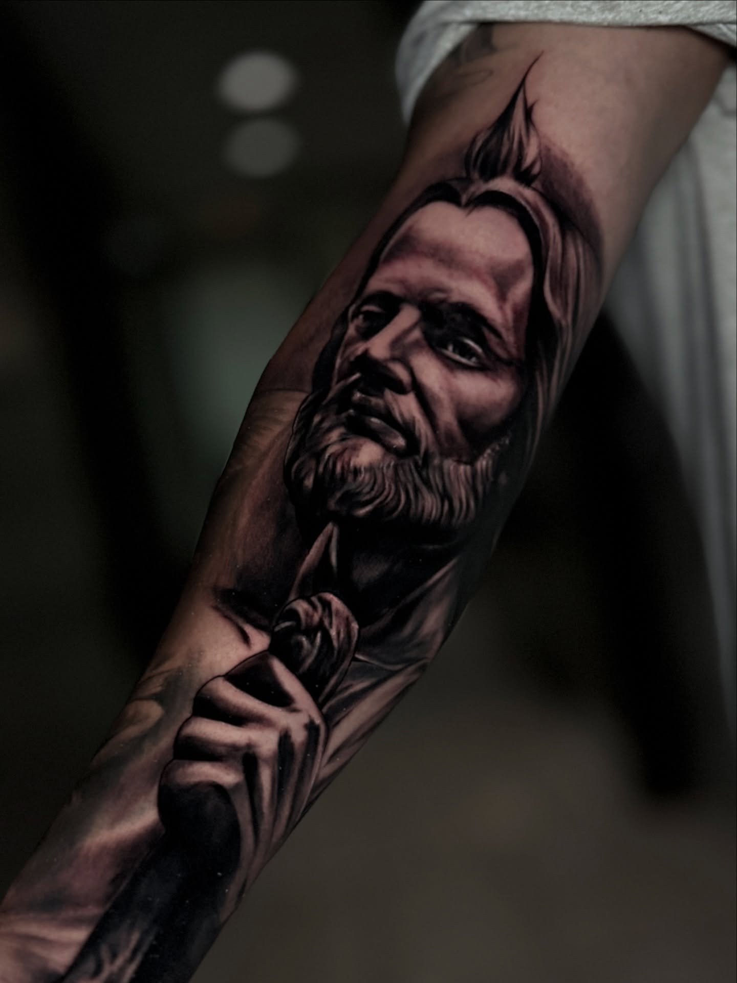 Religious figure realism tattoo on the forearm by Jesse Temores