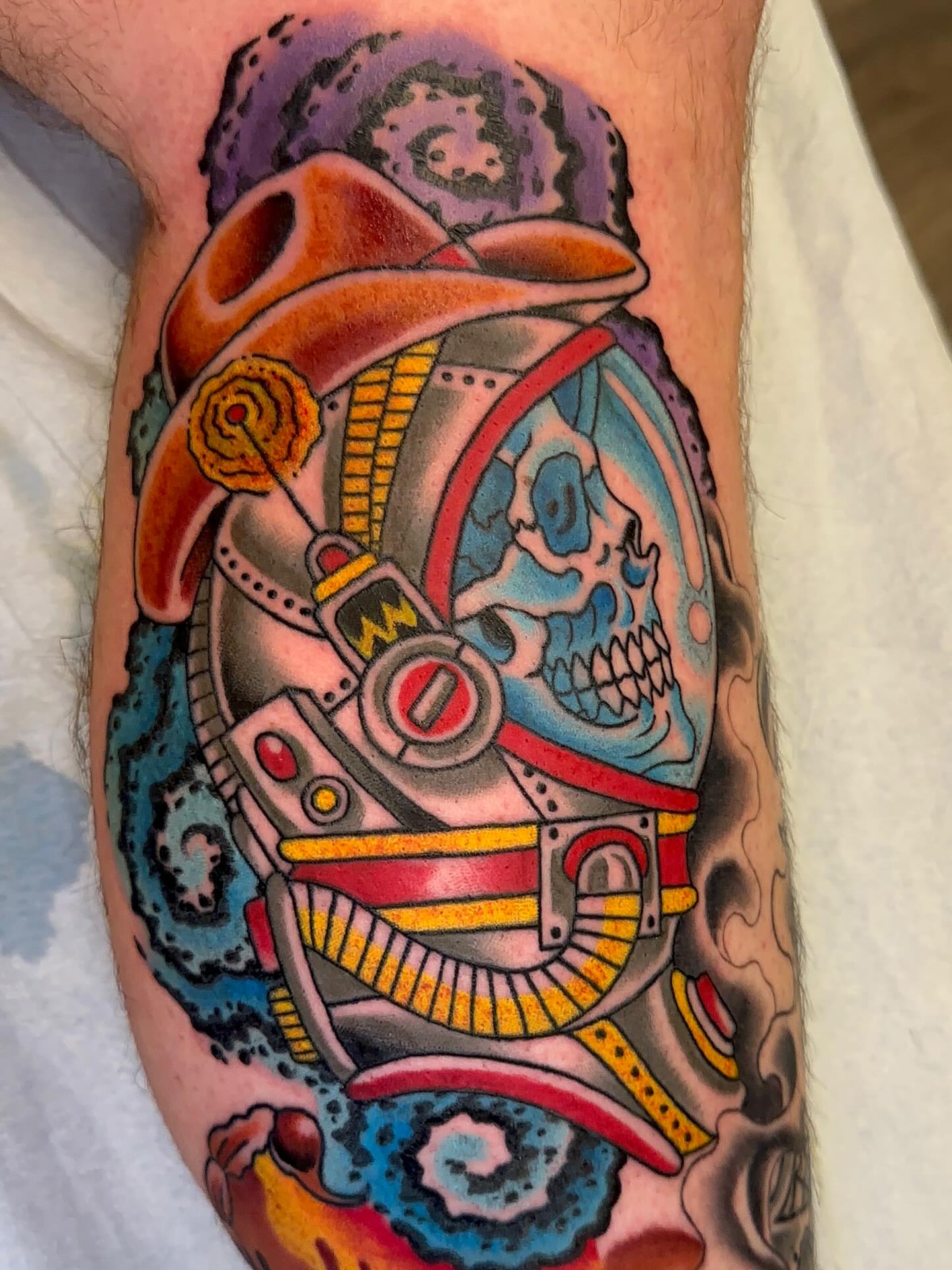 Astronaut skull new school tattoo on the forearm by Cody Hanson