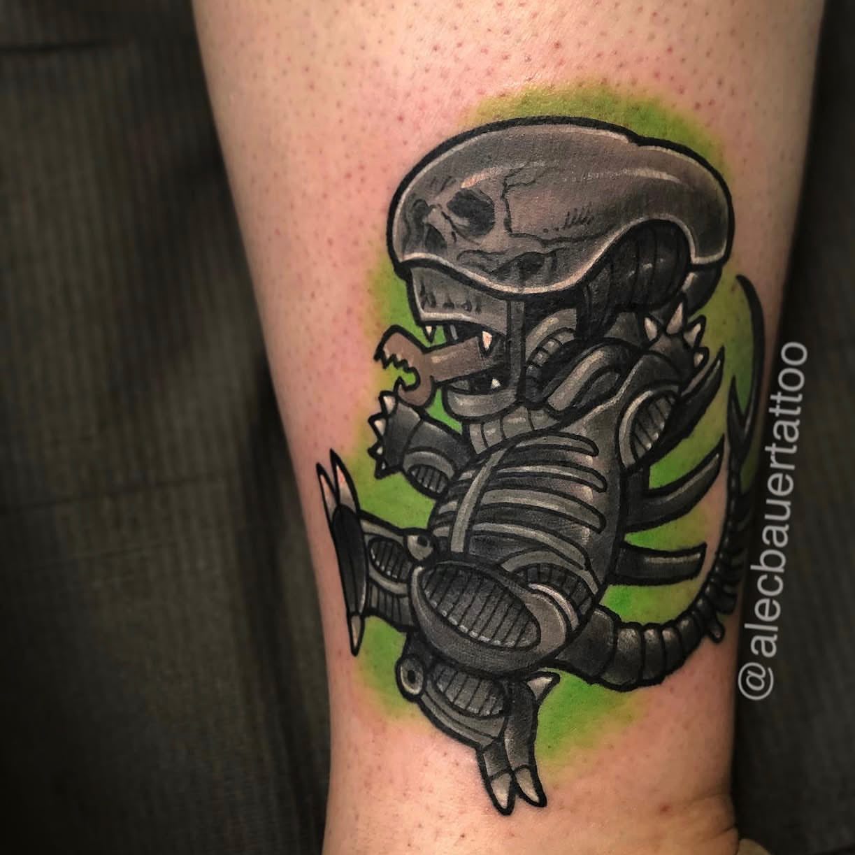 Alien baby American traditional tattoo on the forearm by Alec Bauer