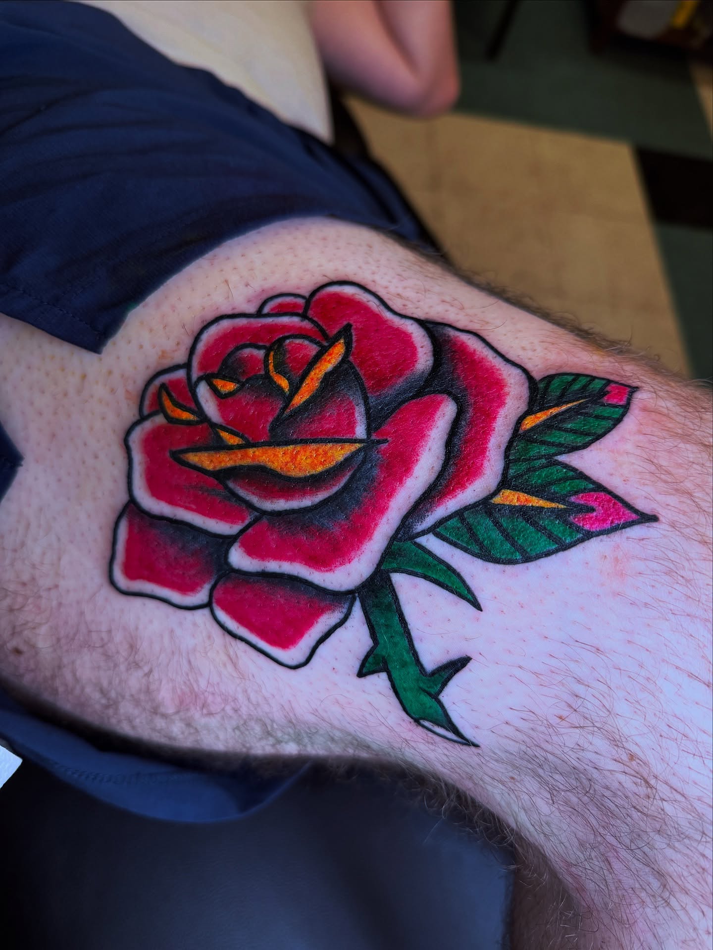 Rose American traditional tattoo on the thigh by Brandon