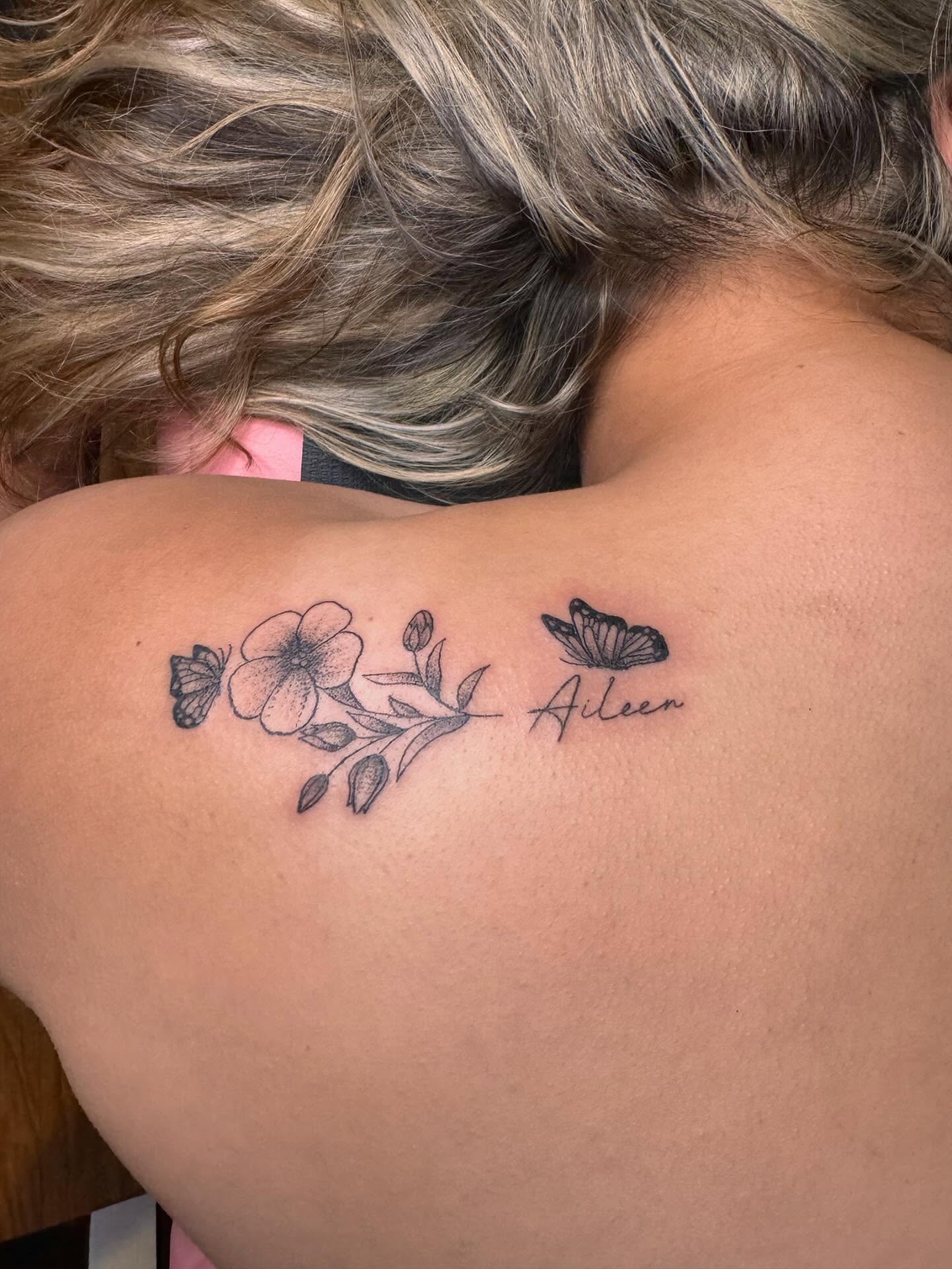 Flower and butterfly black and grey tattoo on the back by Gabs Borderline Tattoos βπΌ