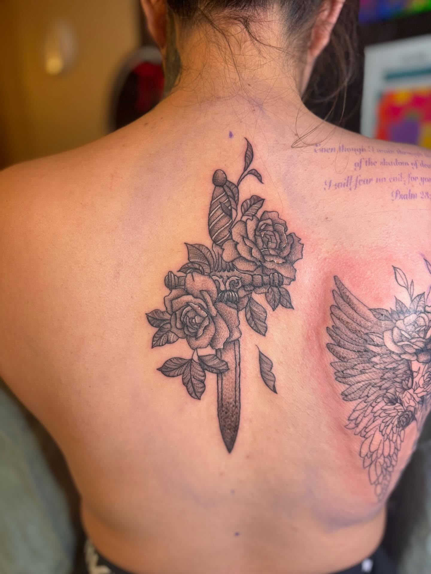 Flower bouquet with dagger black and grey tattoo on the back by Gabs Borderline Tattoos βπΌ