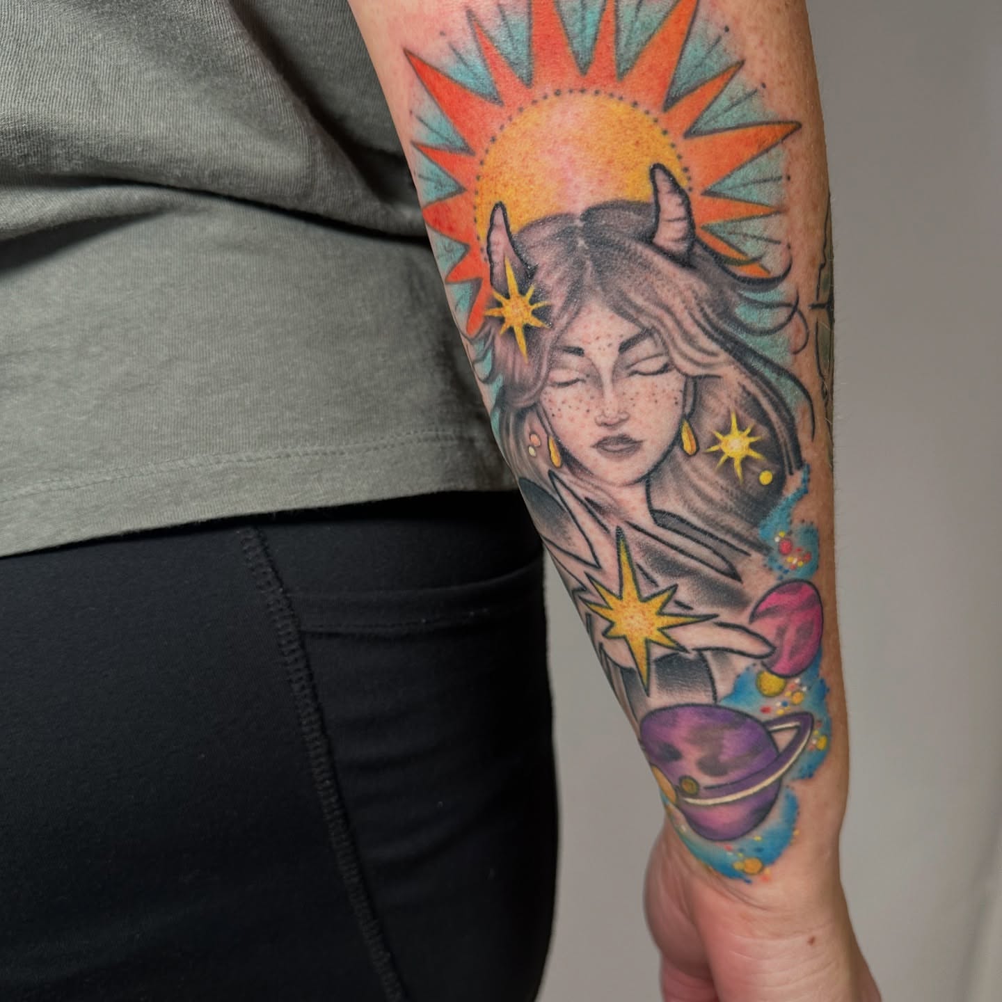 Woman with horns illustrative tattoo on the forearm by Heather Cherish
