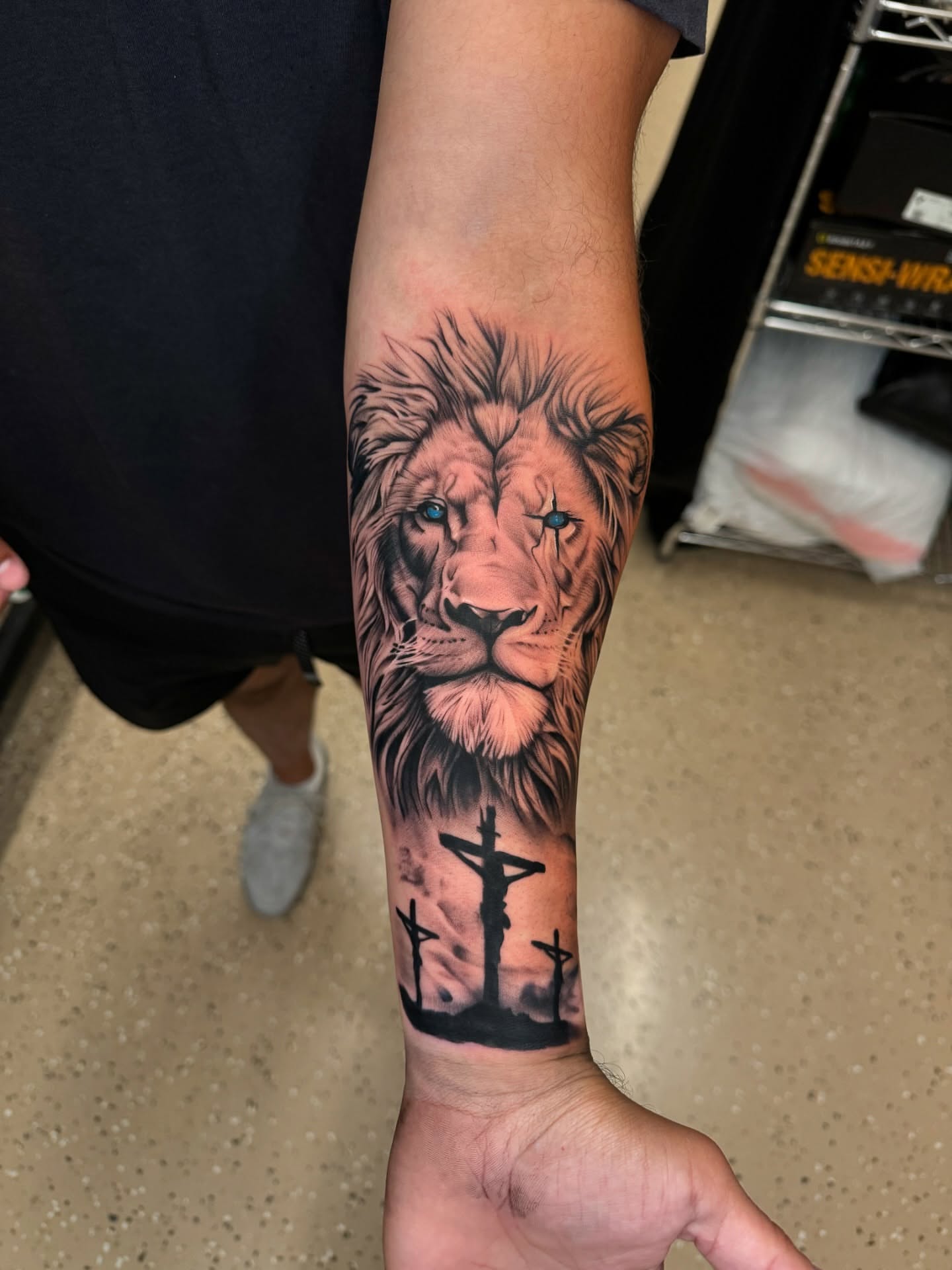 Lion realism tattoo on the forearm by Ian Chancellor, Leighton Buzzard, England