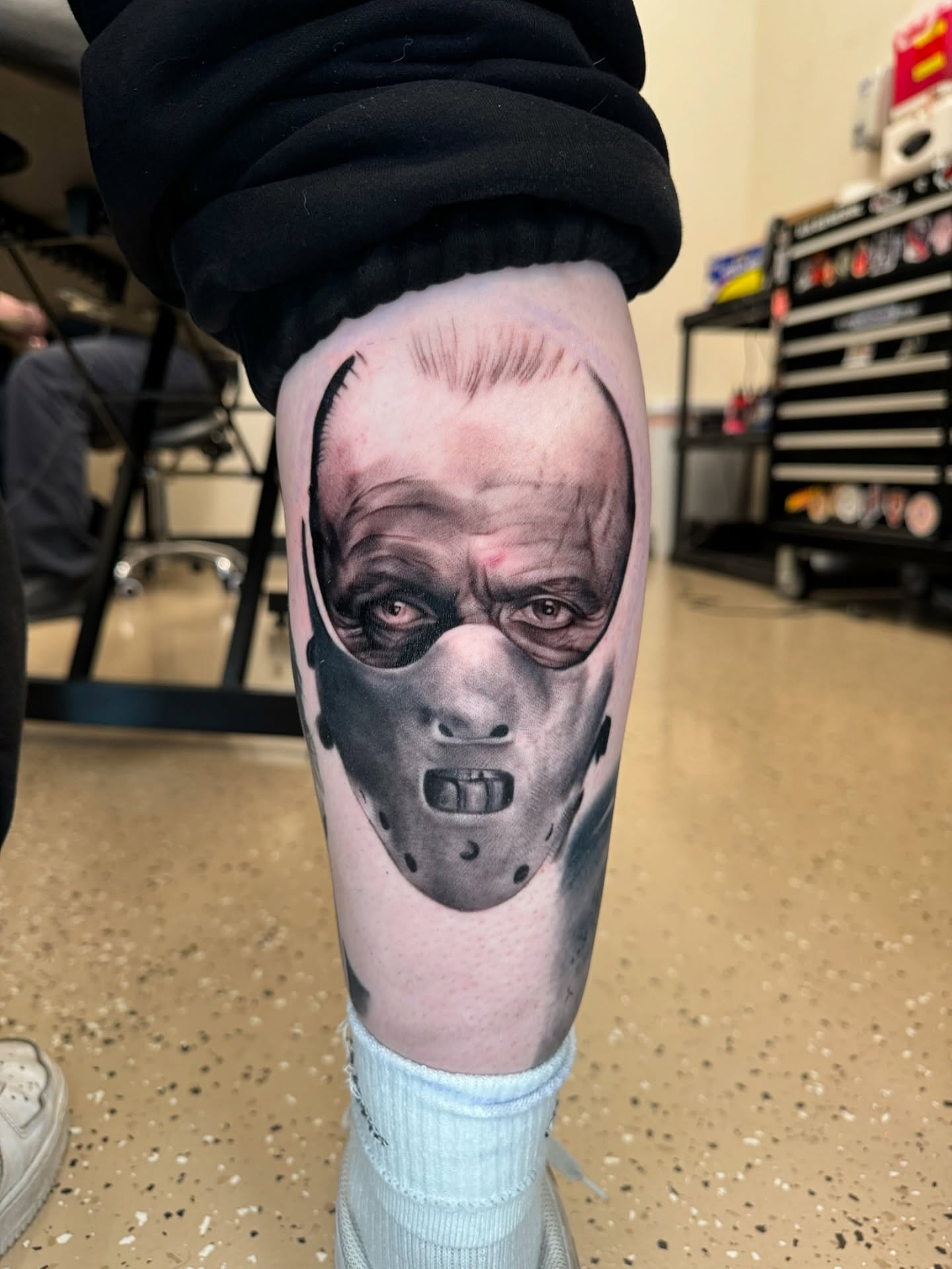 Mask realism tattoo on the forearm by Ian Chancellor, Leighton Buzzard, England