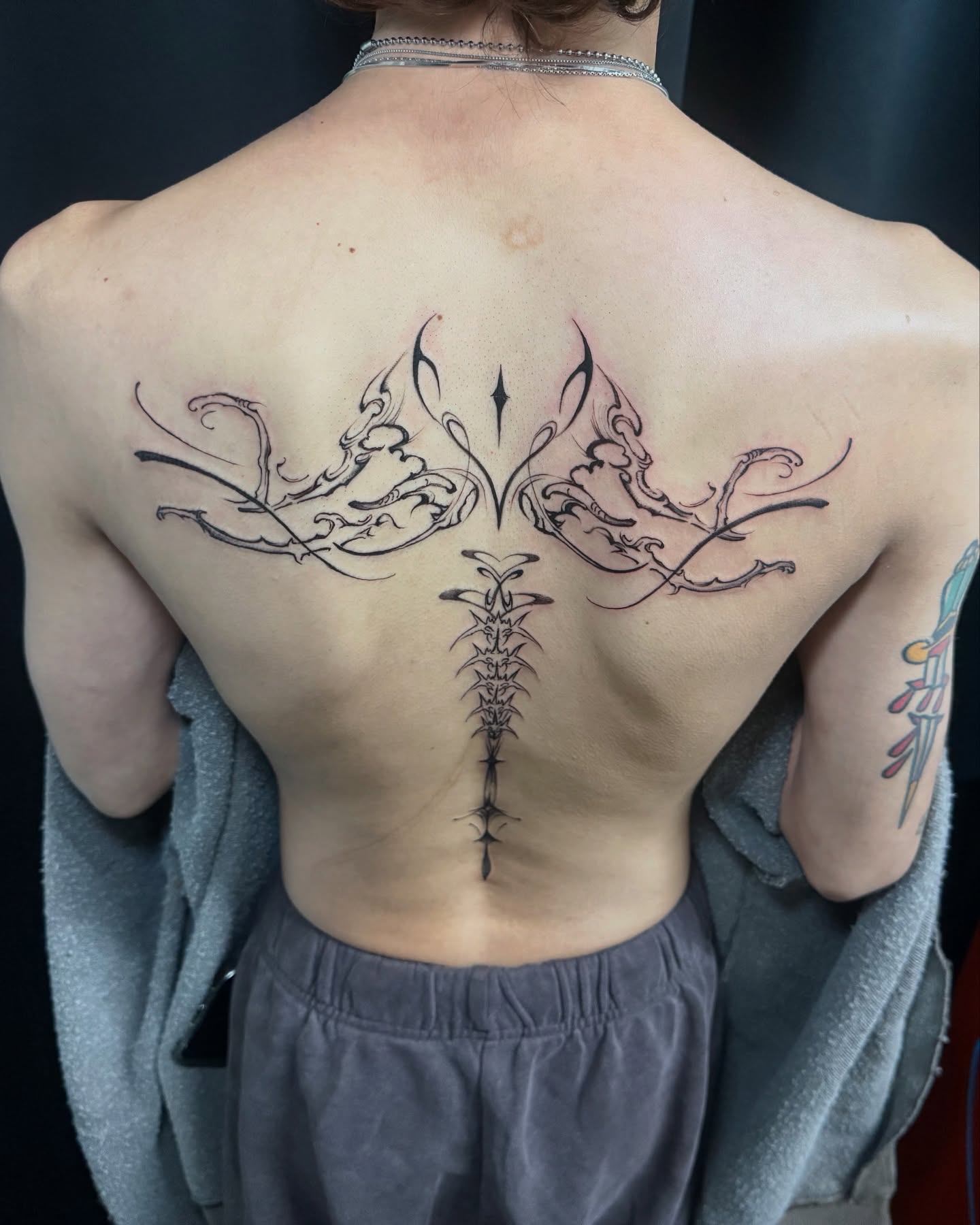 Cross with wings tribal tattoo on the back by G̵̨̗̗̈̅̓́͡ĕ̸̡̜̫̾̌̎̈͠ë̷̢̳̤̰̗͈̃͌͒̚͞