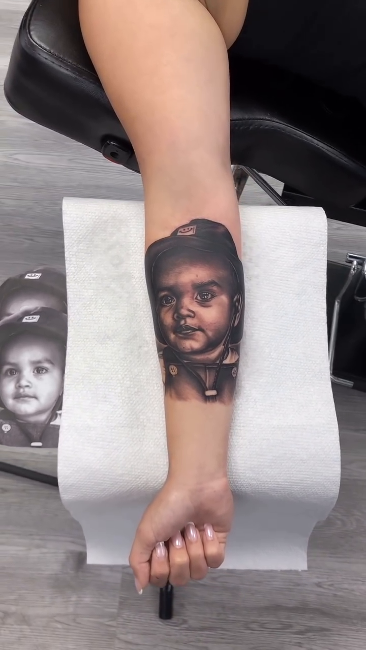 Baby portrait realism tattoo by Danny Rodriguez