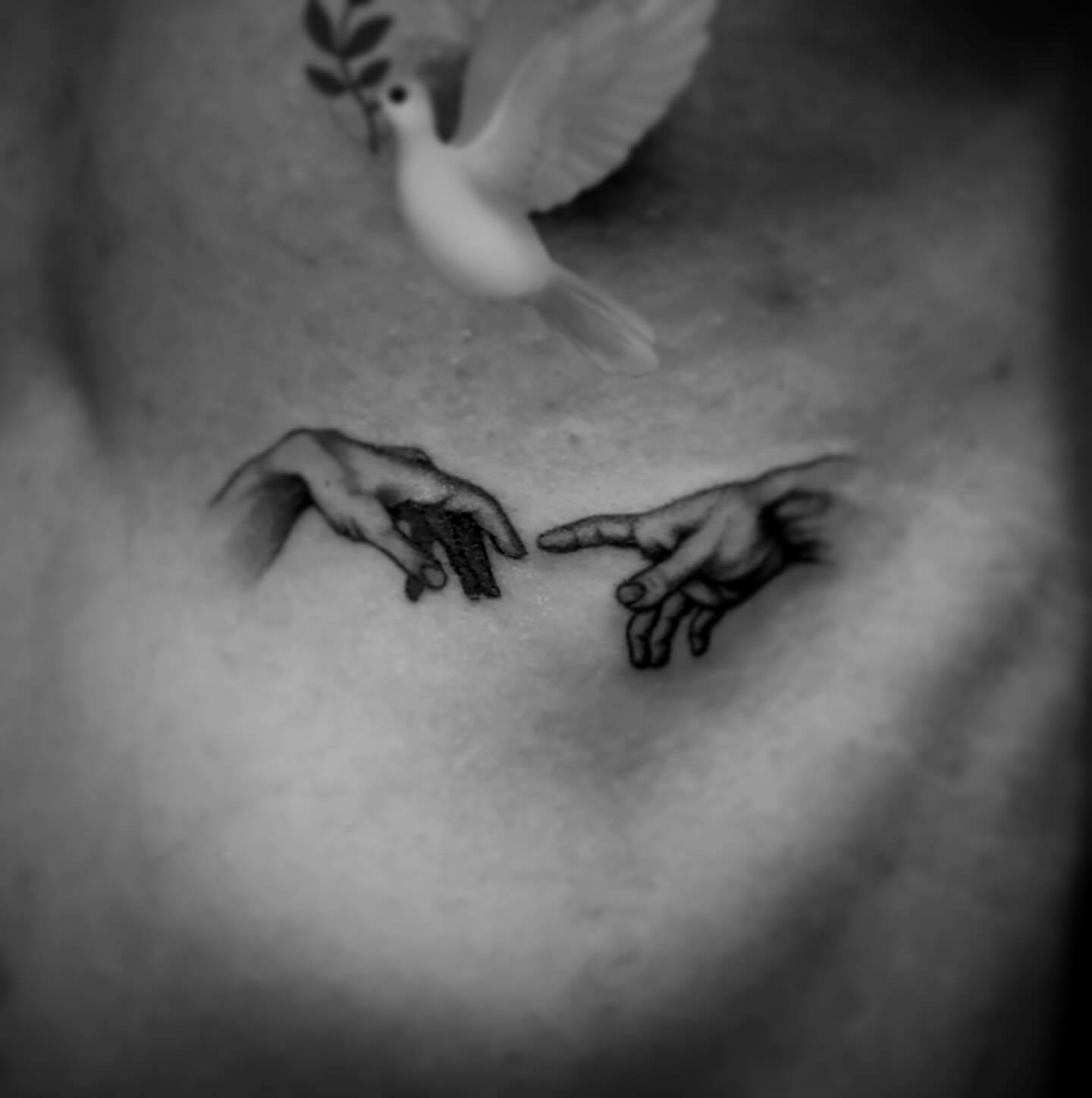 Hands reaching realism tattoo on the chest by Jameson William Cowan
