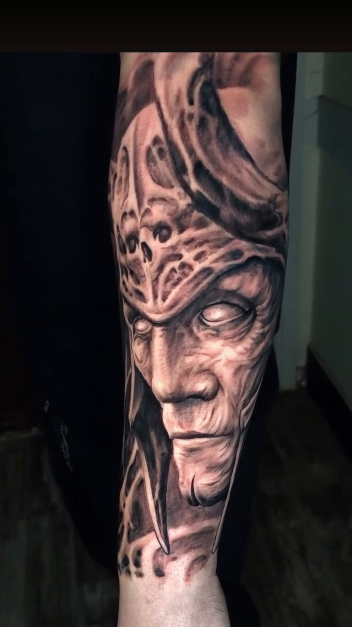 Face with helmet realism tattoo by Oak Adams